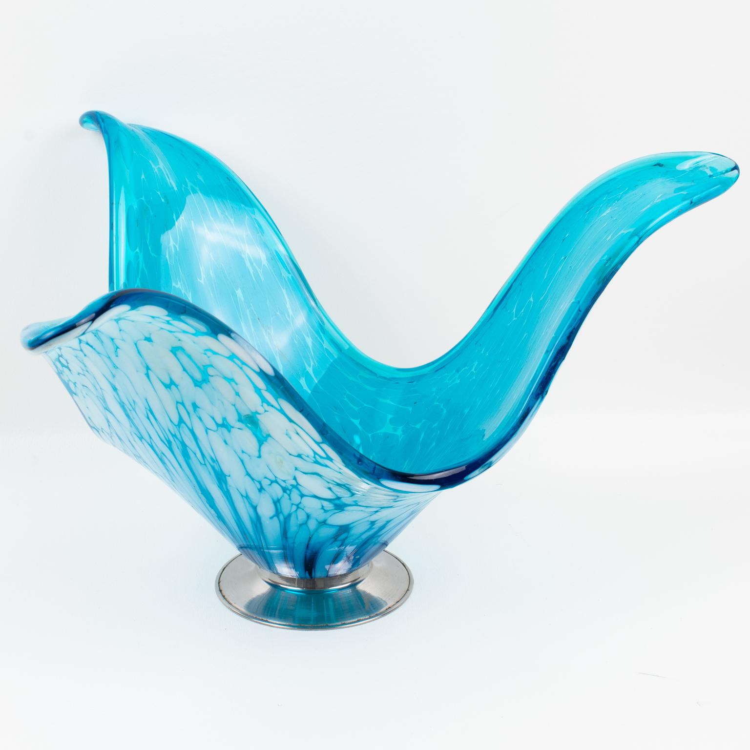 This gorgeous blown Art glass vase or centerpiece bowl was designed in Murano, Italy, in the 1960s. The large organic and sculptural shape has a stylized jellyfish or Medusa pattern with turquoise blue color and white bubbling inclusions. The piece