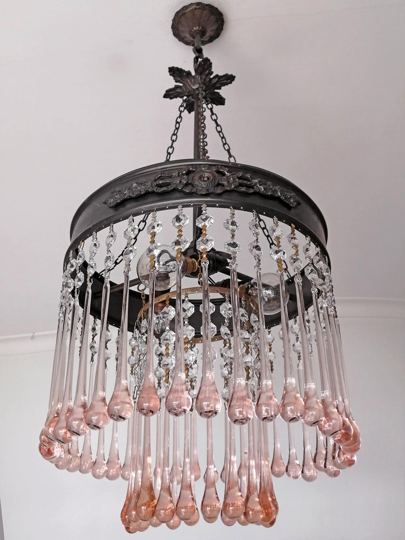 Beautiful antique Italian Art Nouveau and Art Deco Murano hand blown pink crystals tear drop bronze chandelier in a radial pattern with a very sparkling effect typical of Hollywood style and glamour. 

Measures:
Diameter 11.81 in /30 cm
Height