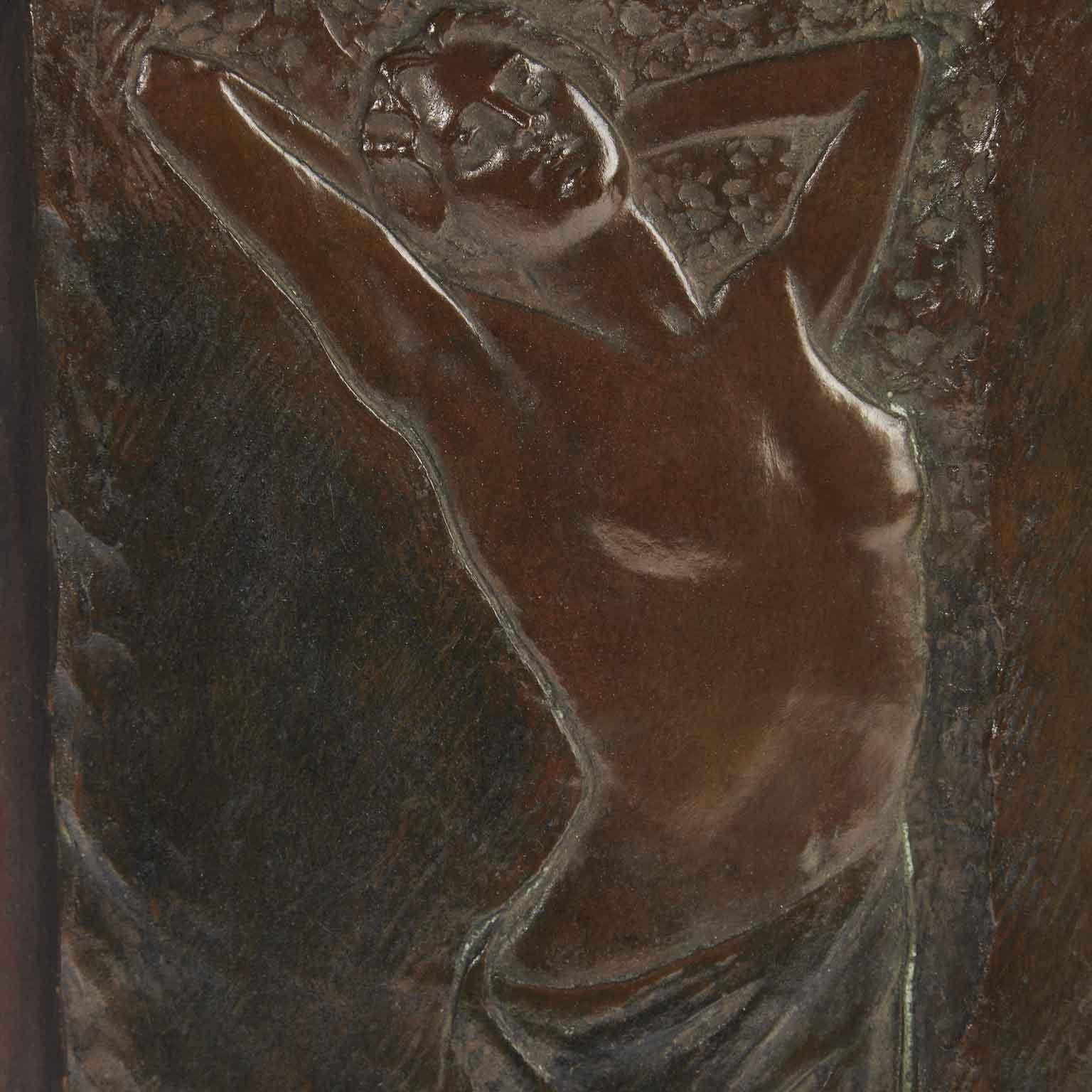 An Italian early 20th century Art Nouveau cast bronze sculpture, a bas-relief depicting a partially nude woman by Goria Lamberto, signed L.Goria Asti (Tortona 1863 – Asti 1927). Mounted on a wooden panel, it is in good age related condition, with a