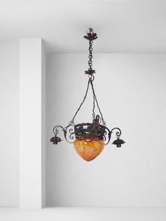 Italian Art Nouveau chandelier made of iron and carved orange glass