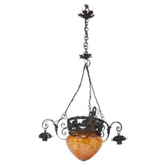 Italian Art Nouveau chandelier made of iron and carved orange glass