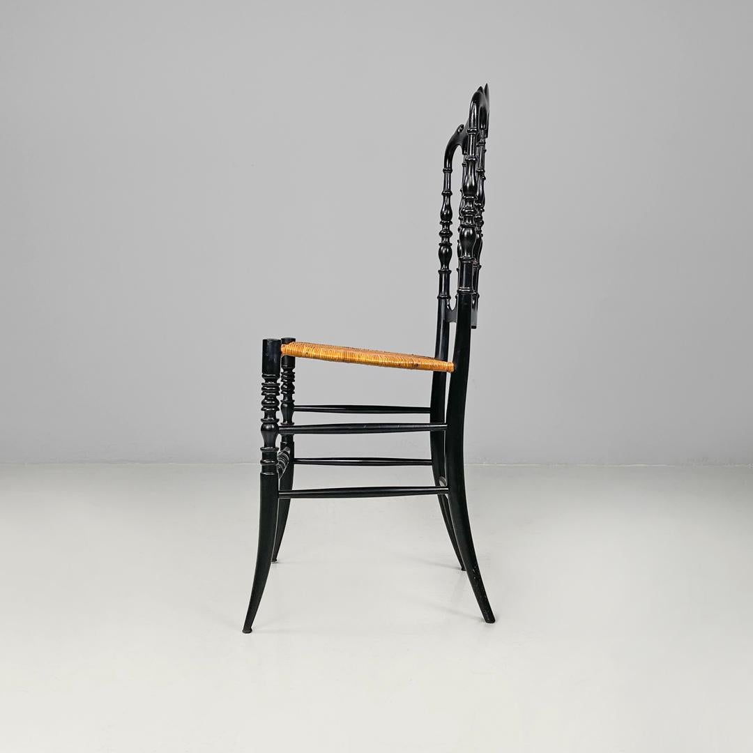 Early 20th Century Italian Art Nouveau Chiavarina chairs in black wood and wicker, early 1900s For Sale