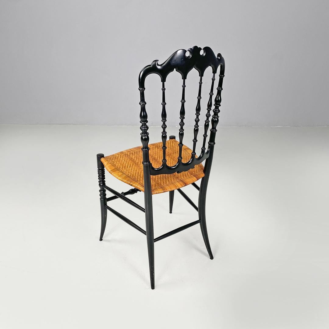Wicker Italian Art Nouveau Chiavarina chairs in black wood and wicker, early 1900s For Sale