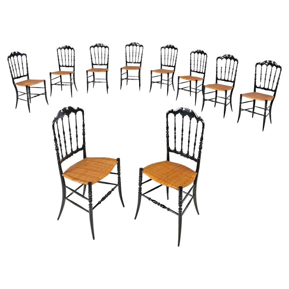 Italian Art Nouveau Chiavarina chairs in black wood and wicker, early 1900s For Sale