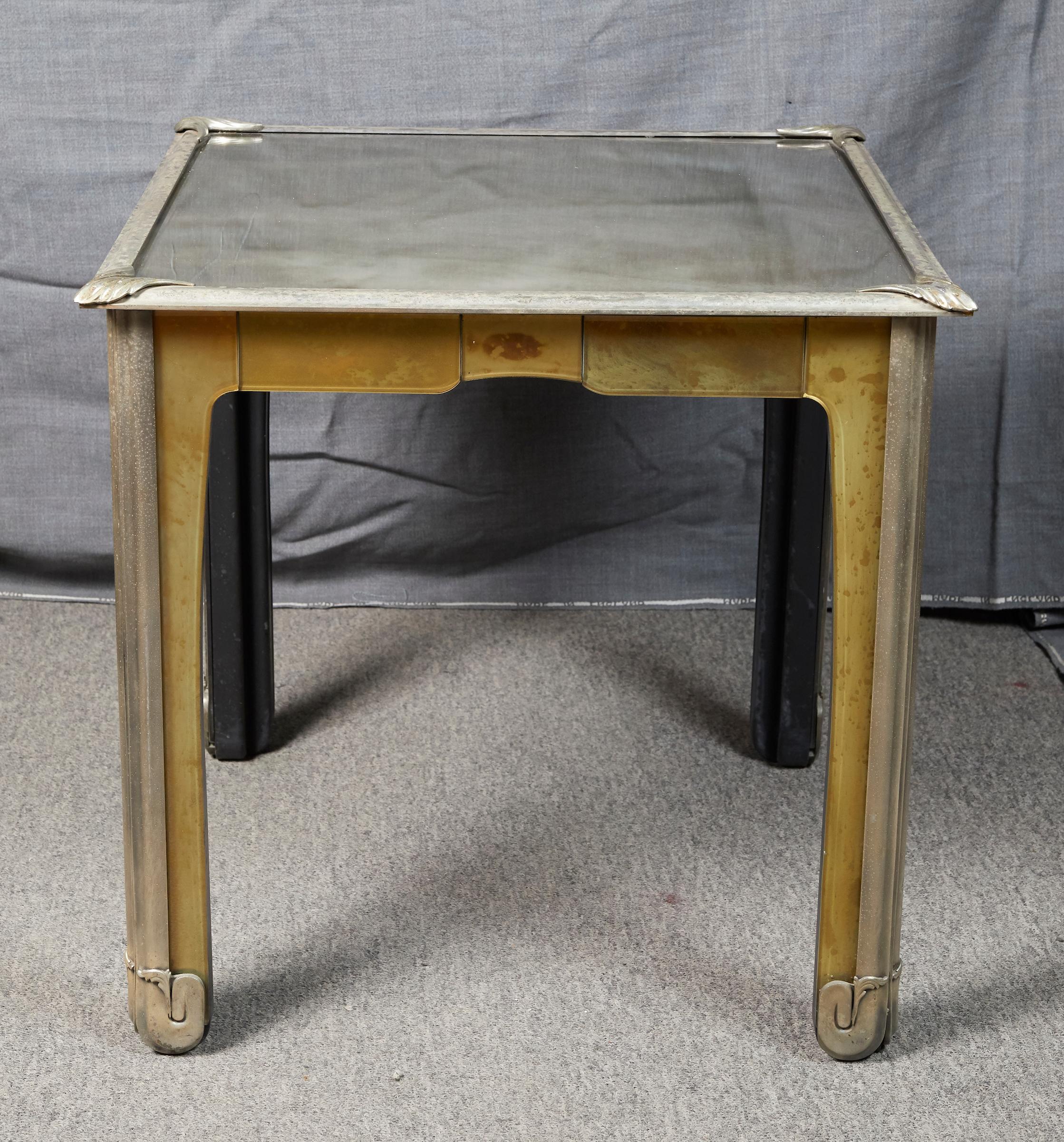 Elegant Italian Art Nouveau style silvered metal and patinated mirrored side table.