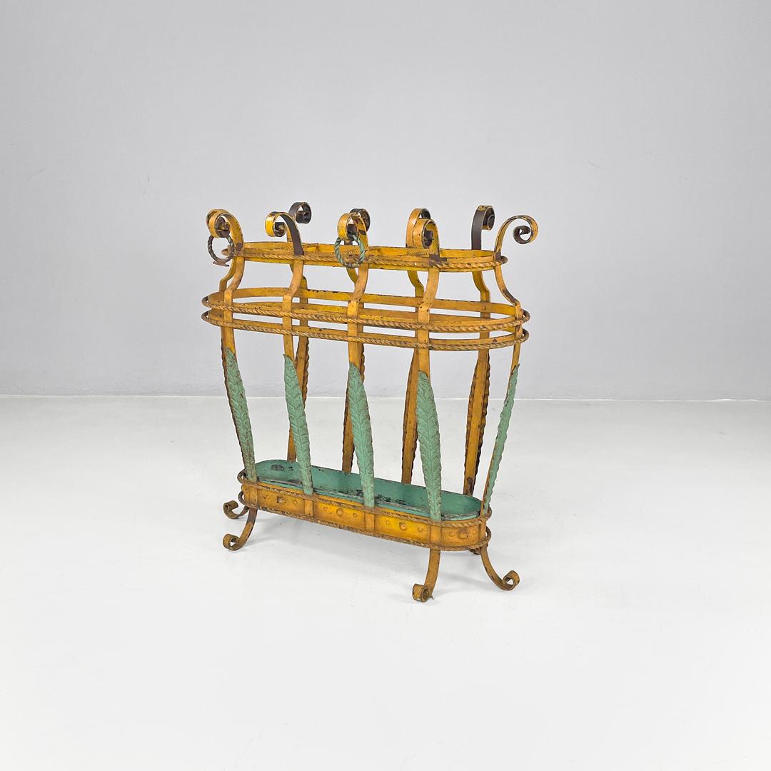 Italian Art Nouveau yellow and green wrought iron umbrella stand, 1900s
Wrought iron umbrella stand with elliptical base. The structure is made up of ten bands that end, at the top, with a spiral motif, two bands have a ring. The bands are welded to