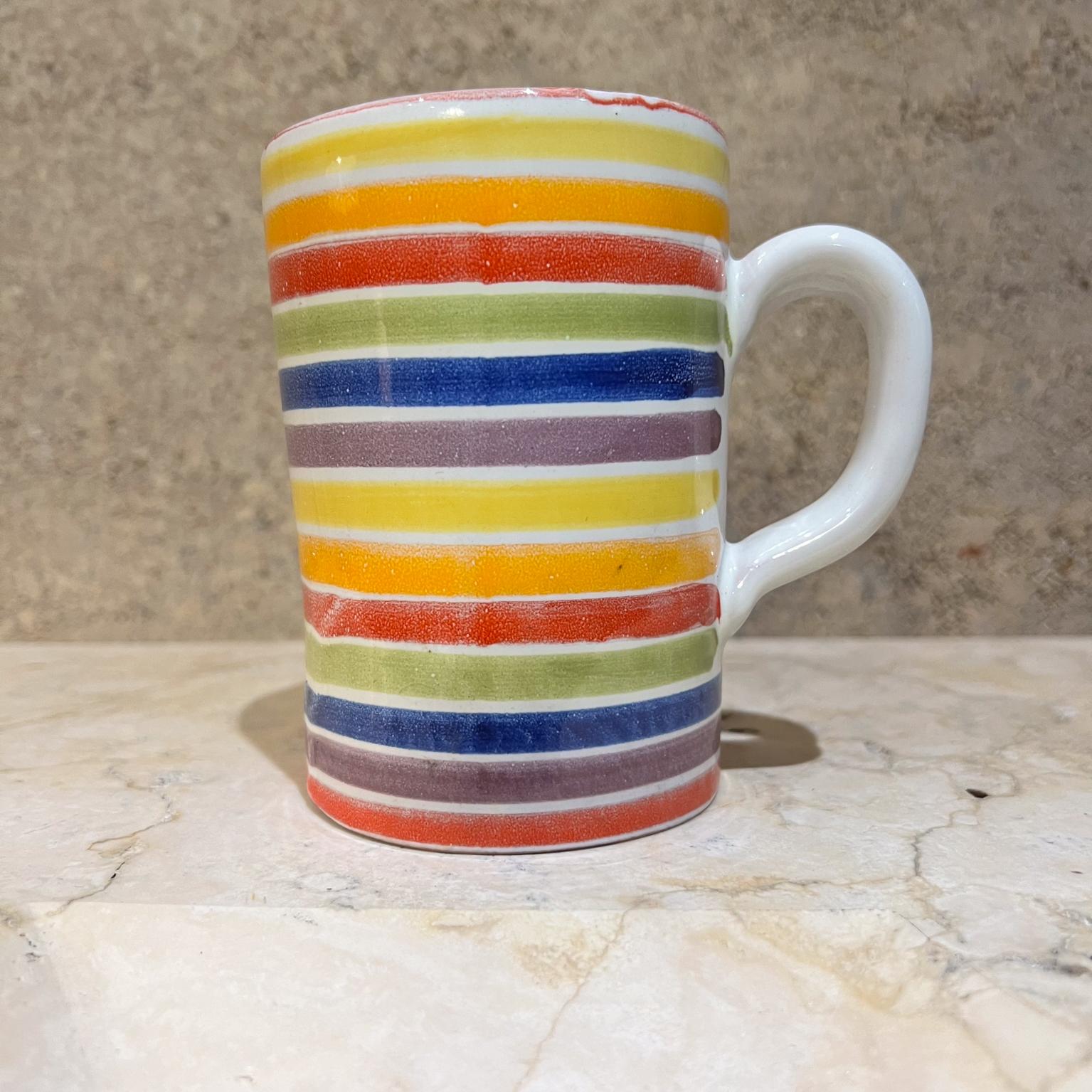 Italian rainbow coffee mug
stamped Italy
colorful art pottery
4.5 h x 4.75 d x 3.25 
Original vintage
Refer to images for condition