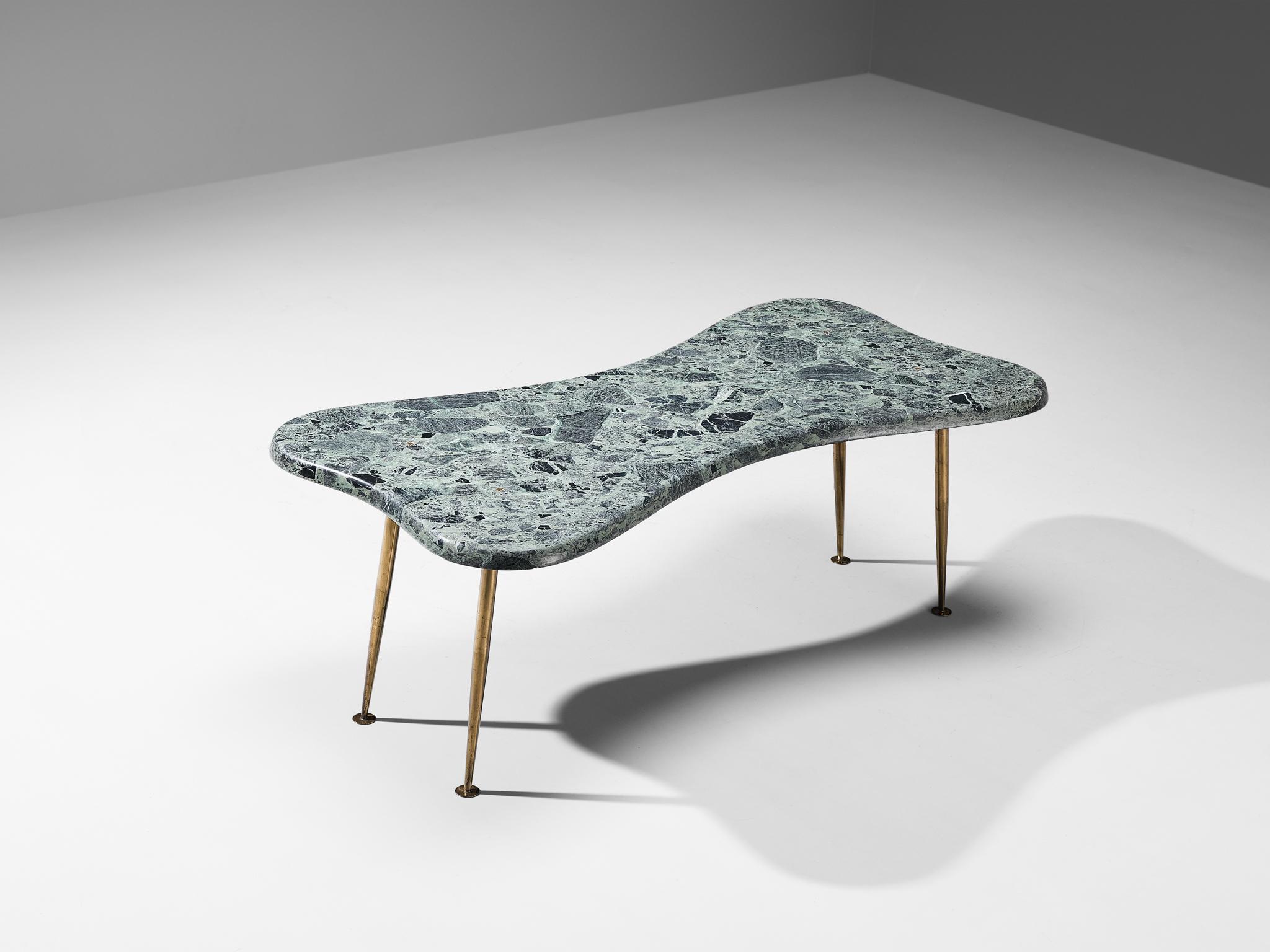 Coffee table, marble, brass, bronze Italy, 1950s

Hailing from a skilled artisan of Italy, this exceptional coffee table reflects the design principles of the Mid-Century era that rose to prominence in the 1950s. The design serves as a testament to