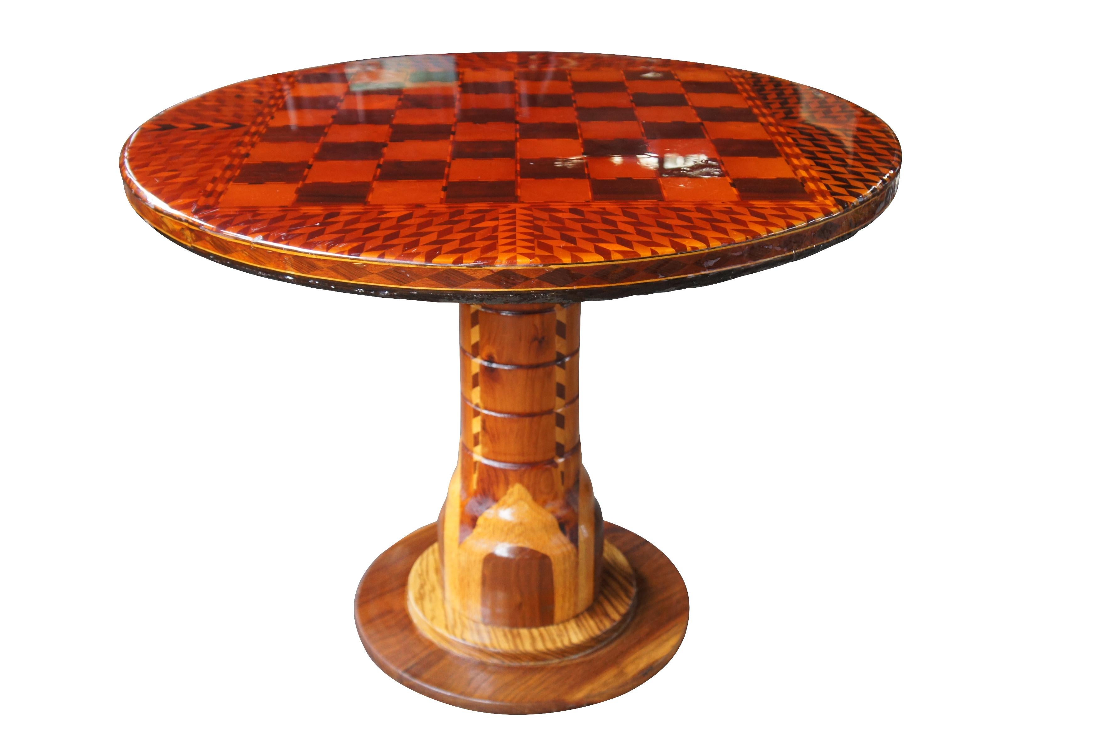 Italian Arts & Crafts chess checkers side end accent game table round parquetry

Vintage Italian Arts & Crafts game table

Features exotic inlaid wood design with pedestal base.
Was most likely purchased years back in Sorrento Italy, where many