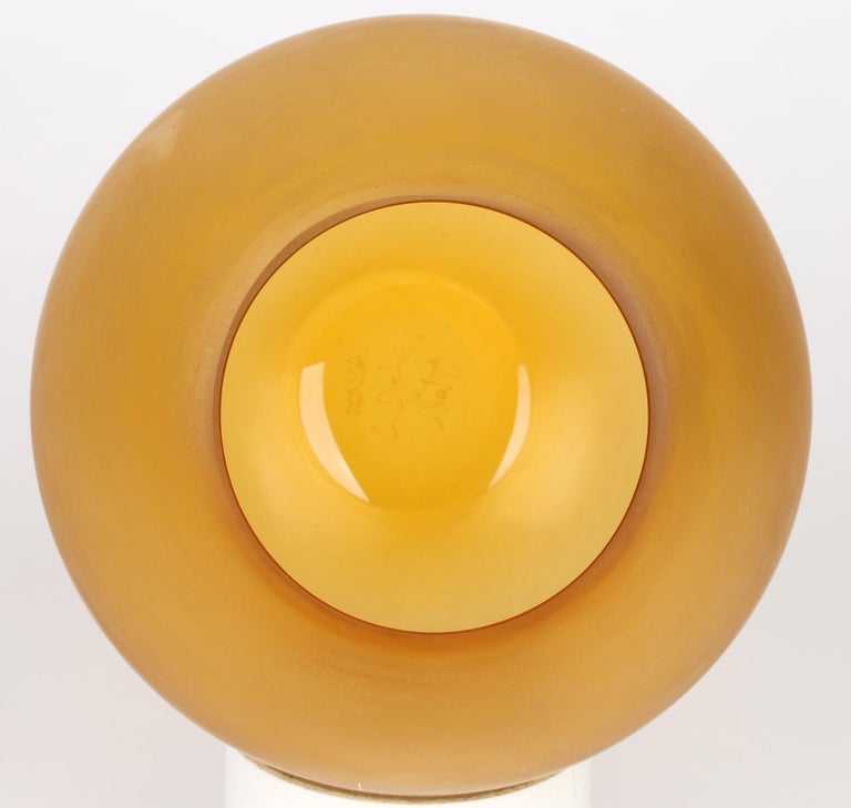 A very stylish Italian attributed art glass amber yellow corroso design vase signed to base and dating from the 20th century. The hand blown vase of simple rounded fish bowl shape has a narrowing edged opening with a flat polished rounded base and
