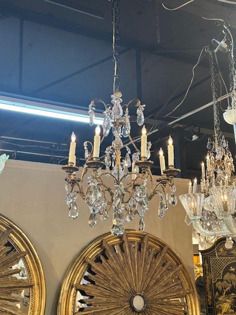 Nice quality early 20th century Italian Bagues manner crystal chandelier. Circa 1920. The chandelier has been professionally rewired, comes with matching chain and canopy. It is ready to hang!