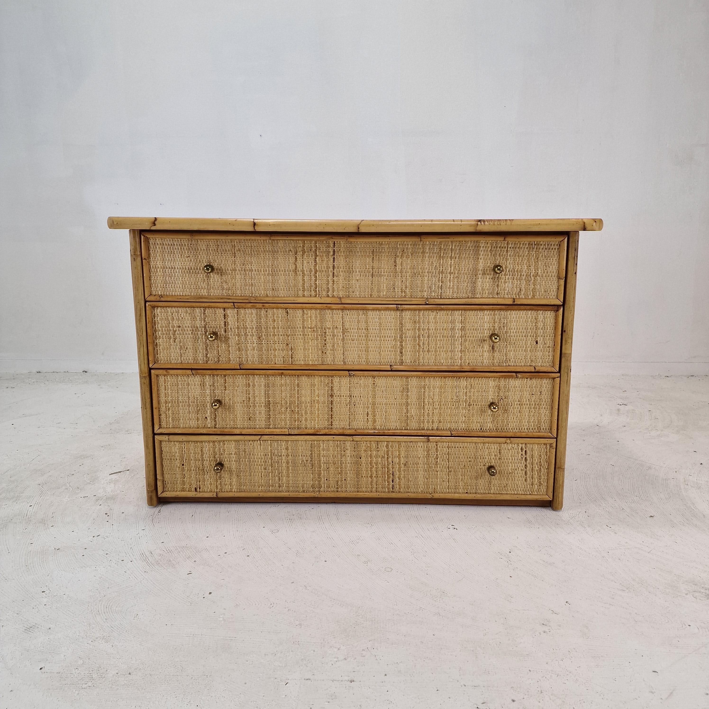 Lovely rectangle credenza or chest of drawers, fabricated in Italy in the 70's. 
This very nice credenza is made of bamboo and rattan.

Four drawers with nice brass grips.

We work with professional packers and shippers, we can deliver