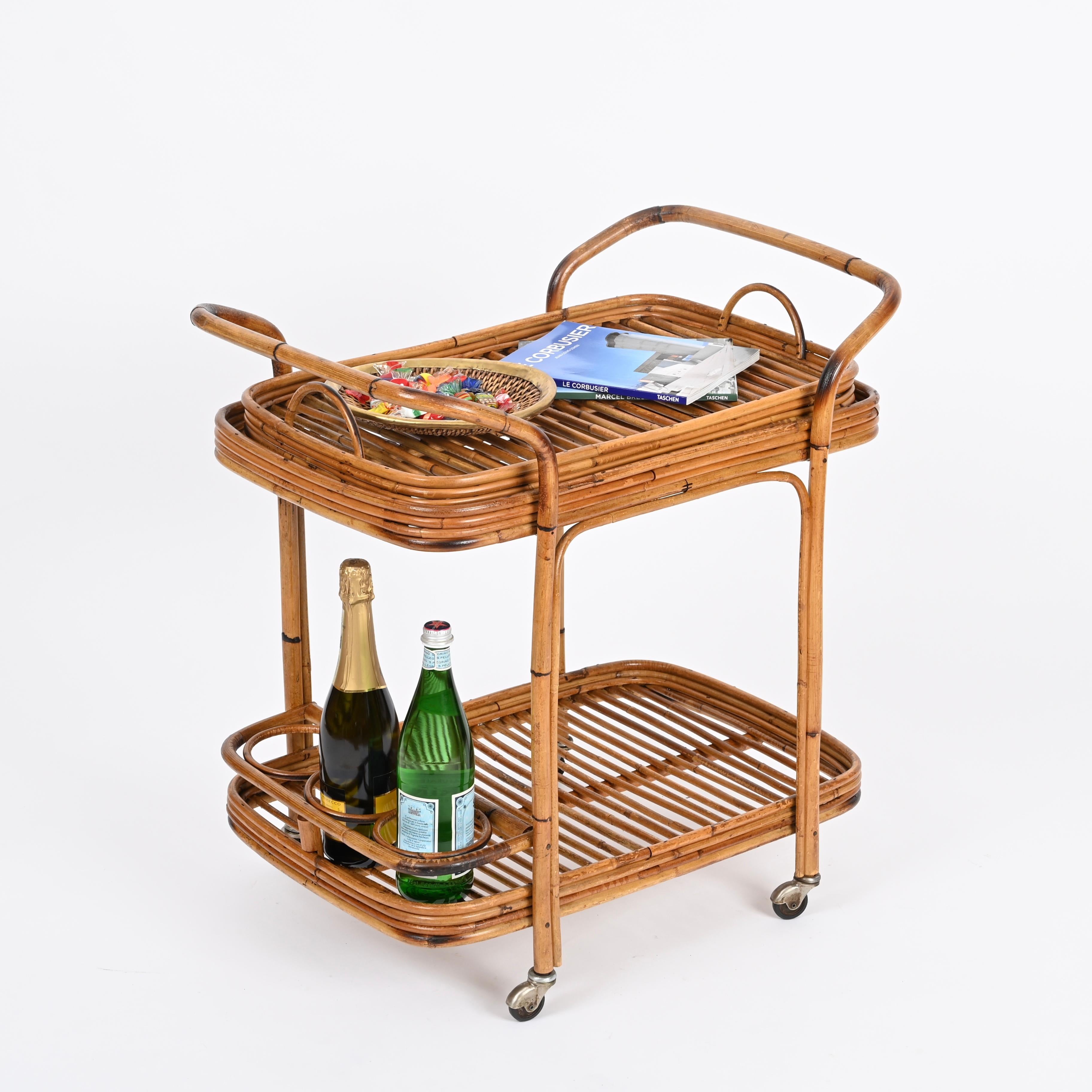 Marvelous mid-century rectangular bar cart trolley with removable top tray fully made in curved bamboo and rattan. This incredibly unique French Riviera style cart was hand-made with perfect proportions, great example of fine Italian craftsmanship