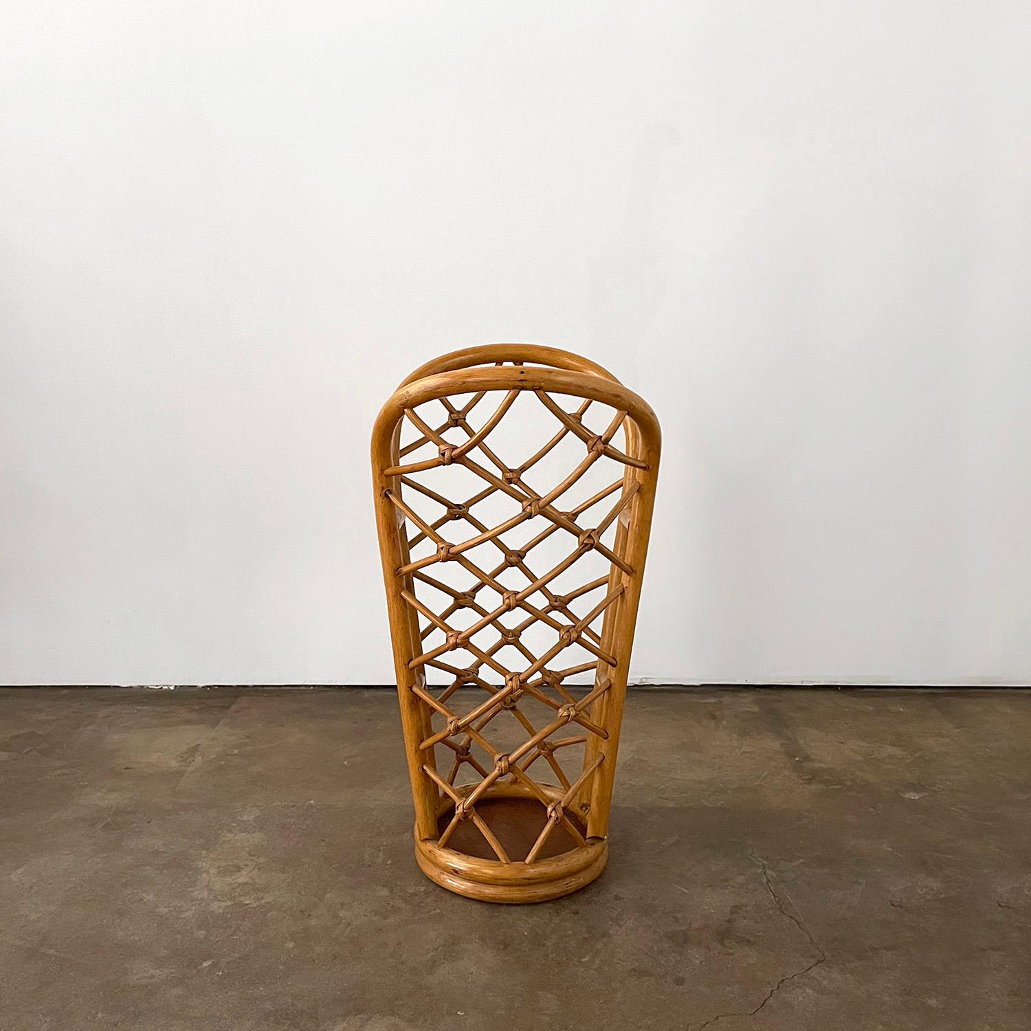 Italian bamboo and rattan umbrella holder 
Sculptural piece
Interlocking woven details with hand tied knots 
Great form and function
Beautifully constructed piece.