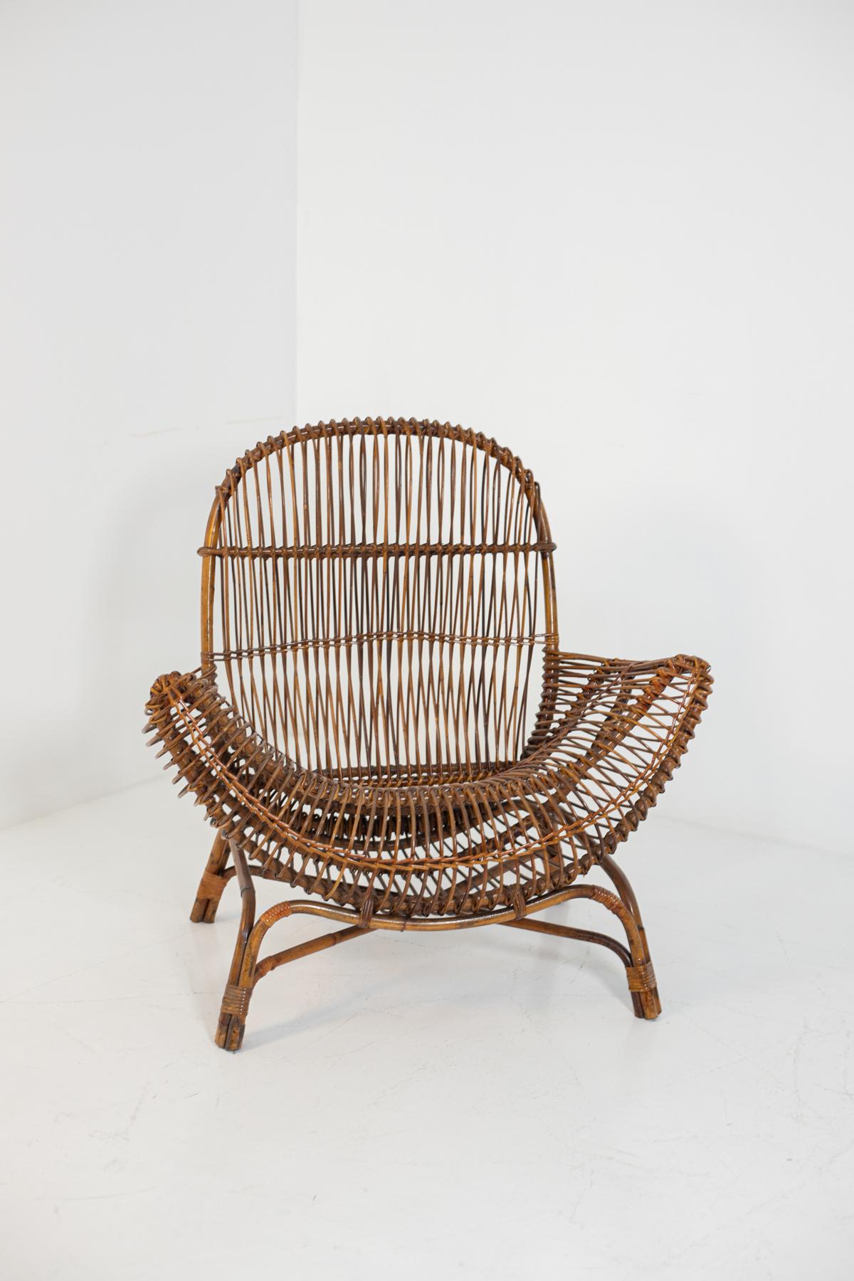 Italian bamboo armchair attributed to Franco Albini from 1950. The armchair has become a real trend in the last couple of years. The armchair's rounded, soft shape conveys softness and solidity. The feet are also made of bamboo canes anchored to the