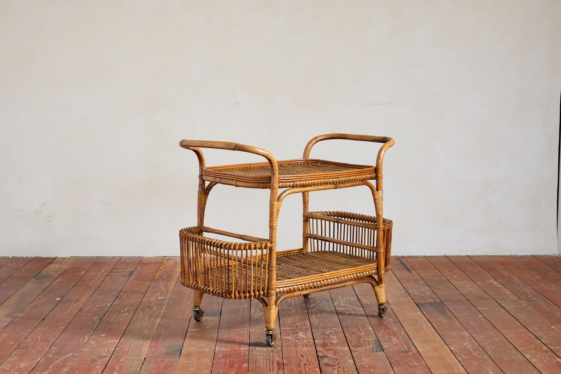 Italian Bamboo and Rattan Bar Cart Trolley with curved pockets for bottles and brass casters
Italy, 1960's 
