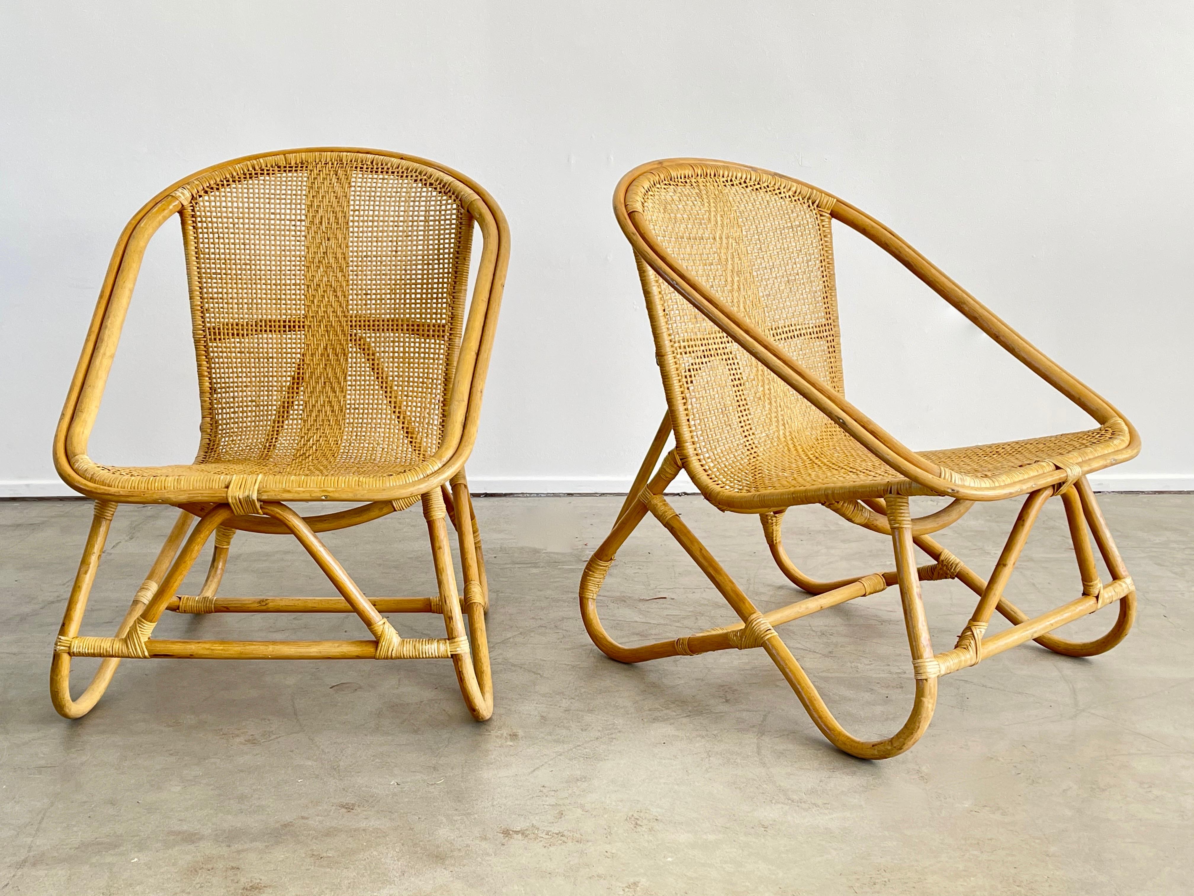 Wonderful pair of Italian bamboo and wicker chairs with great sculptural shape and profile.
Intricate design to wicker -
Set of 4 available, priced as a pair.