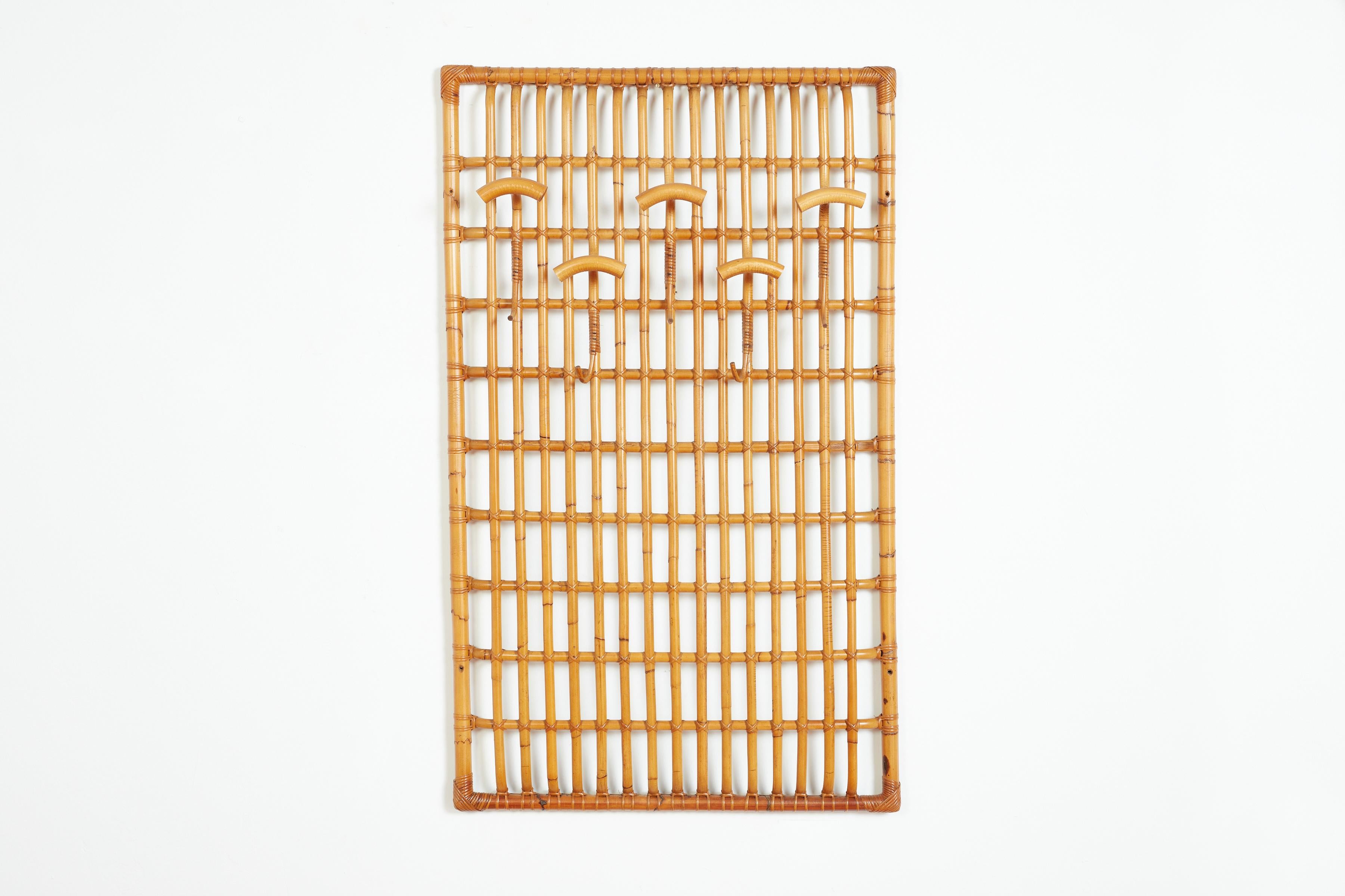 Clean and simple Italian bamboo coatrack wall-mounted with 5 hooks and 5 additional hooks under each one. 
Rectangular shape with nice lighter bamboo color 

