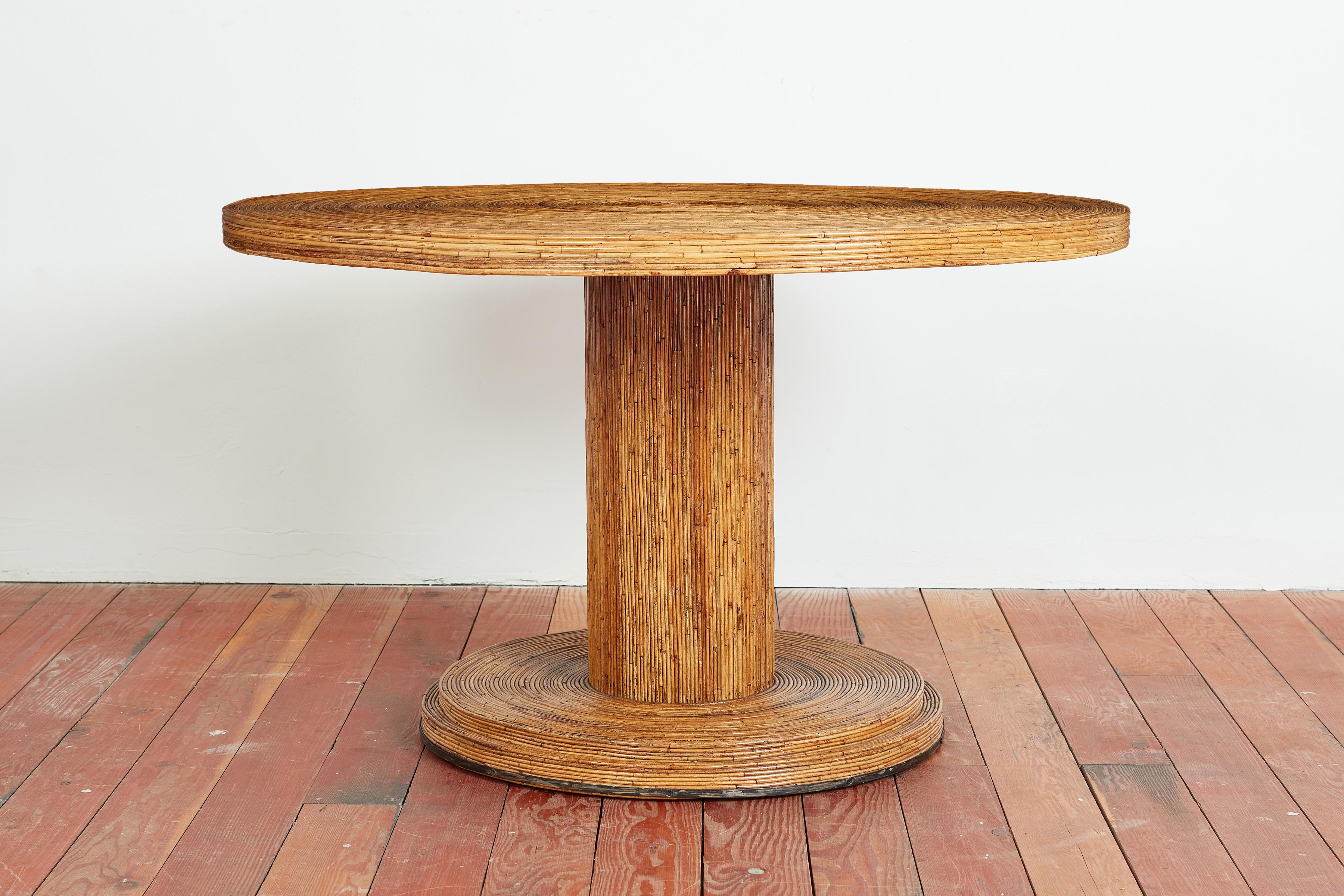 Italian bamboo dining table with concentric circled top and pedestal tulip base. 
Solid and extremely well made - and great design! 
Italy, 1950s