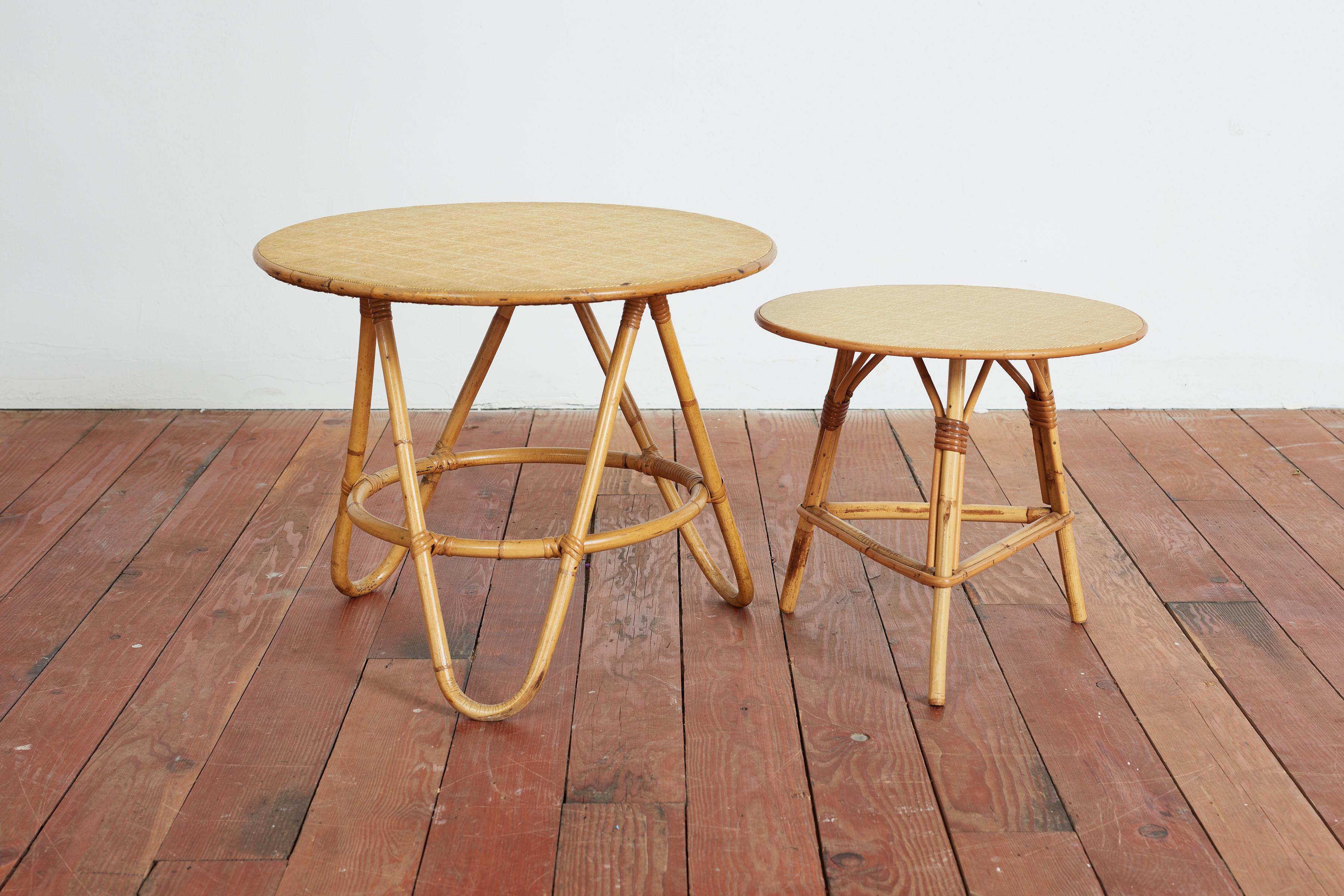 Pair of Italian bamboo nesting tables with interesting bases and woven bamboo tops. 
Italy, 1950s 
Priced as a set 

small table: 16
