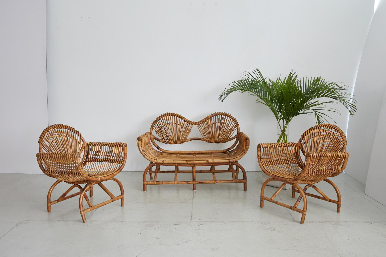 Beautiful set of Italian bamboo chairs and matching settee. Sculptural curved shape with scoop seats and bamboo 