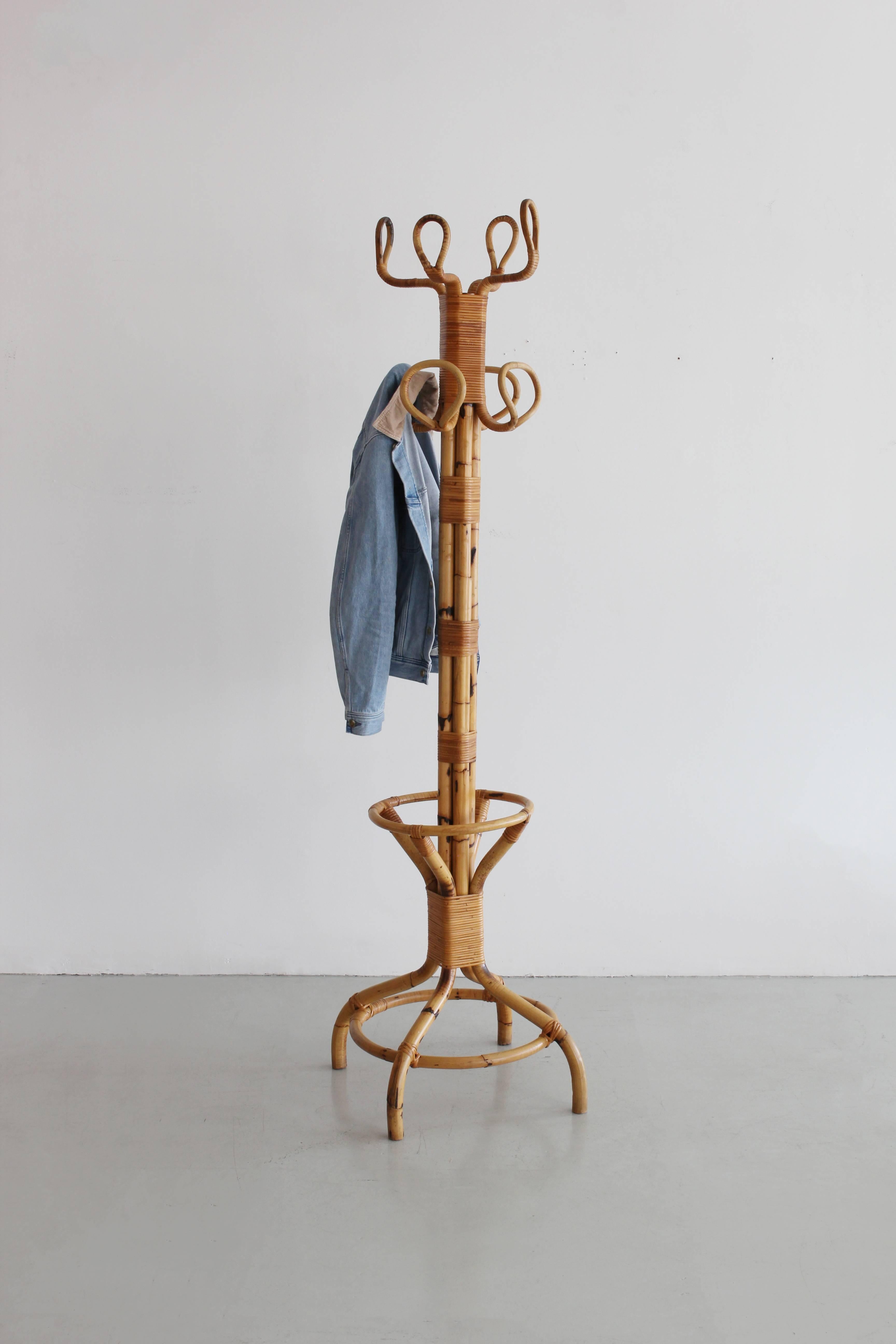 Remarkable bamboo coat rack and umbrella stand from Italy.
Impressive in scale and super sturdy with wonderful patina.