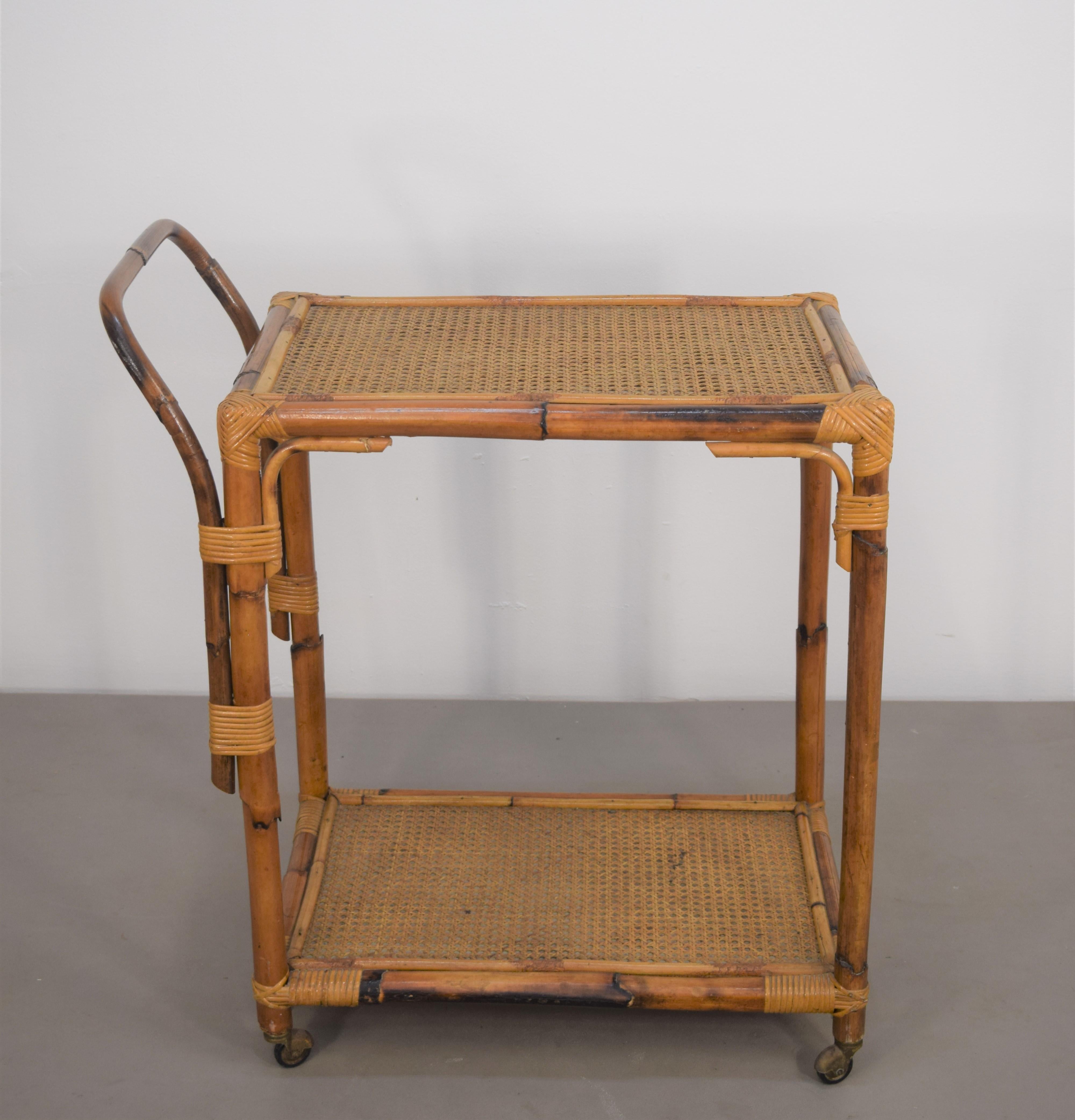 Italian bamboo trolley bar, 1960s.

Dimensions: H= 82 cm; W= 72 cm; D= 41 cm.