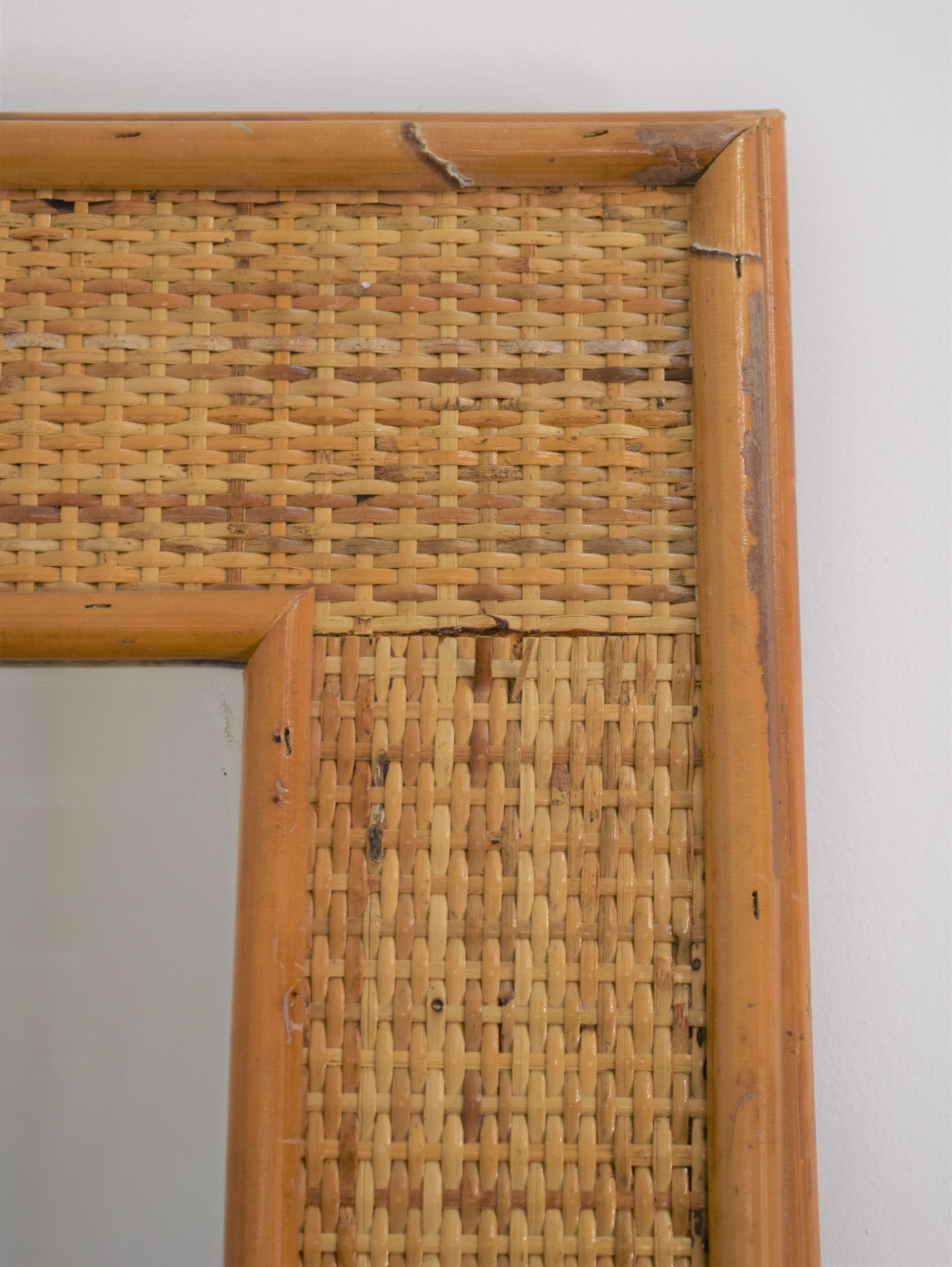Italian bamboo wall mirror, 1960s.

Dimensions: H= 82 cm; W= 60 cm; D= 2 cm.