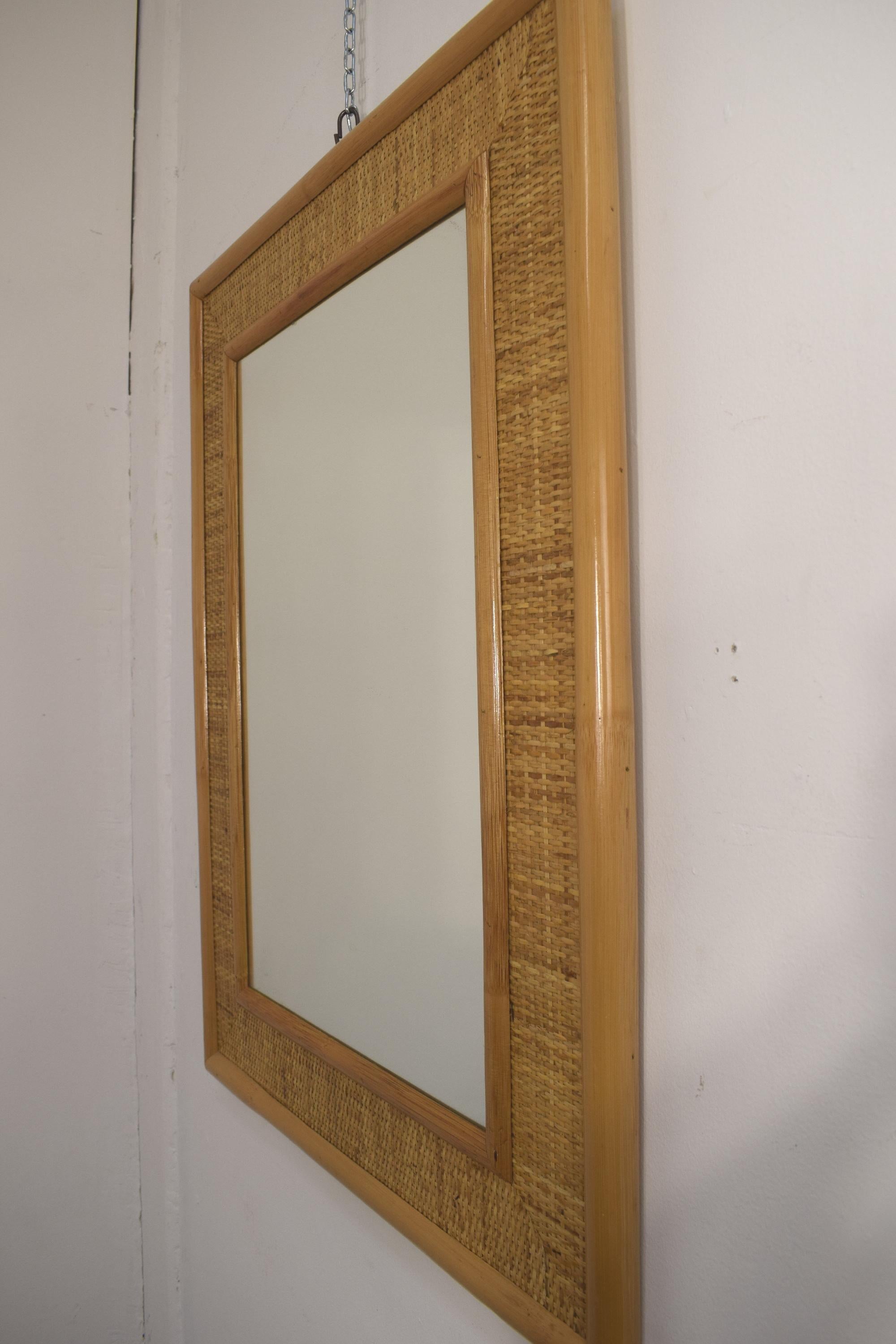 Italian bamboo wall mirror, 1970s.

Dimensions: H= 82 cm; W= 62 cm; D= 3 cm.