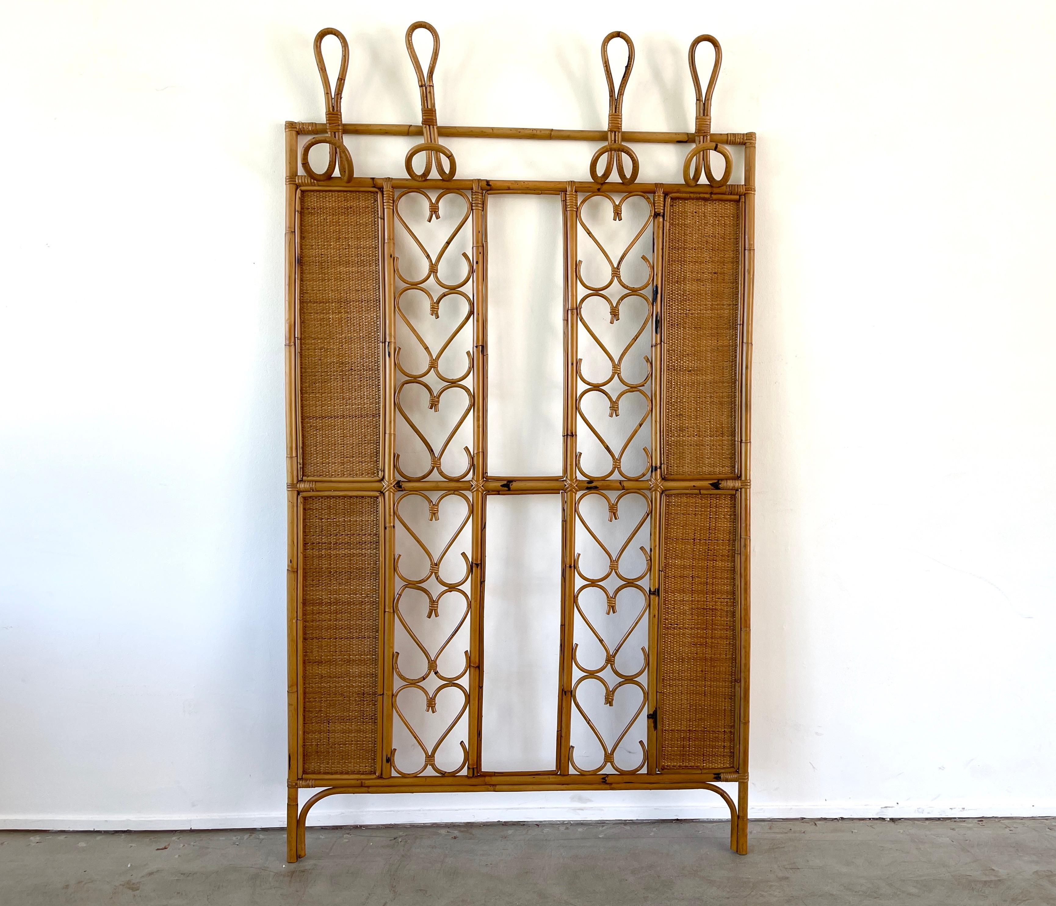 Unique bamboo and wicker Italian wall rack with heart shaped design 
Features 4 double hooks.