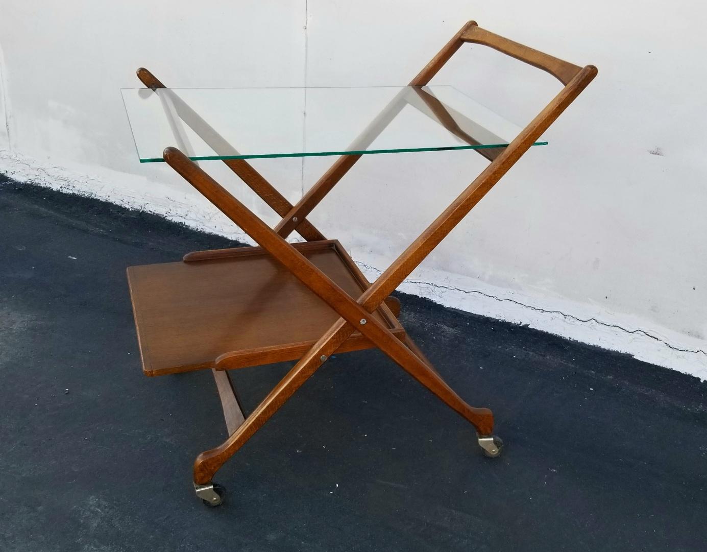 Italian midcentury folding bar cart by Fratelli Reguitti.
Folded dimension: H 41, W 14, D 5 inches.