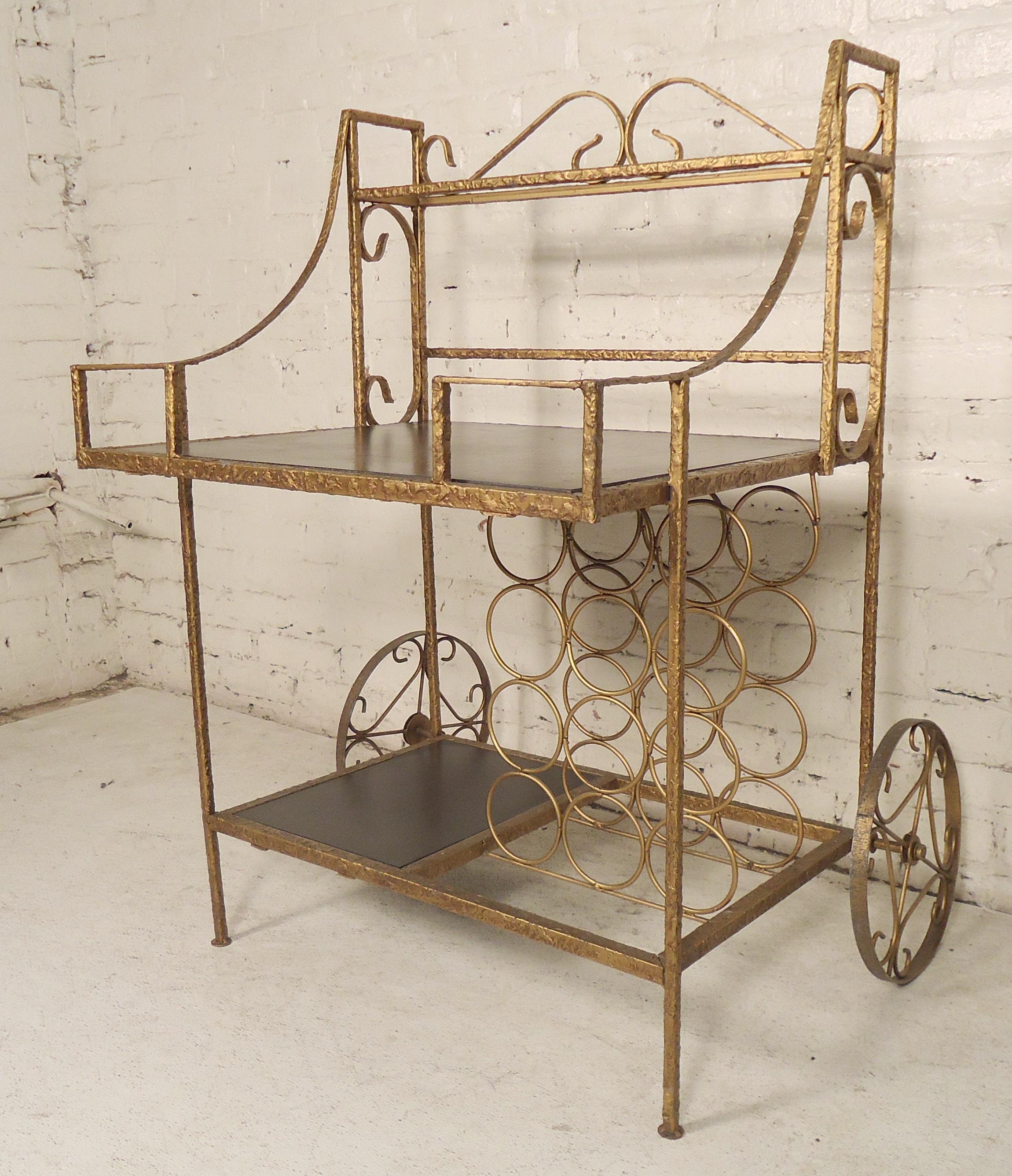 Vintage brass bar cart with black shelving and wine rack.

(Please confirm item location - NY or NJ - with dealer).
 