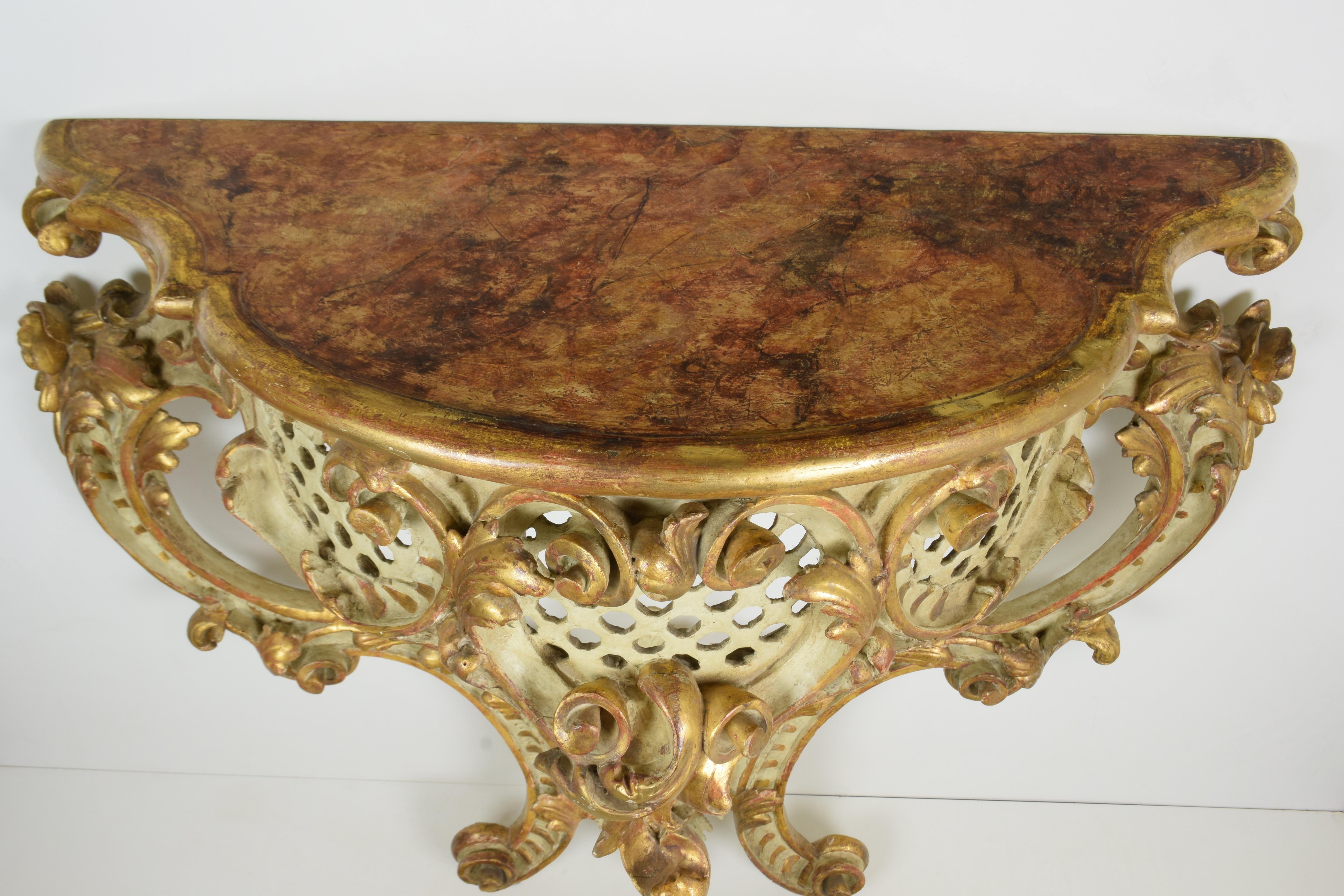Lacquered and gilded pure gold
Faux marble top
Dimensions: cm W 110 x D 45 x H 101

Barocchetto Italiano (DAL 1720 AL 1780)
With the economic decline of the Italian aristocracy, the smaller proportions of Rococo furniture lent themselves to