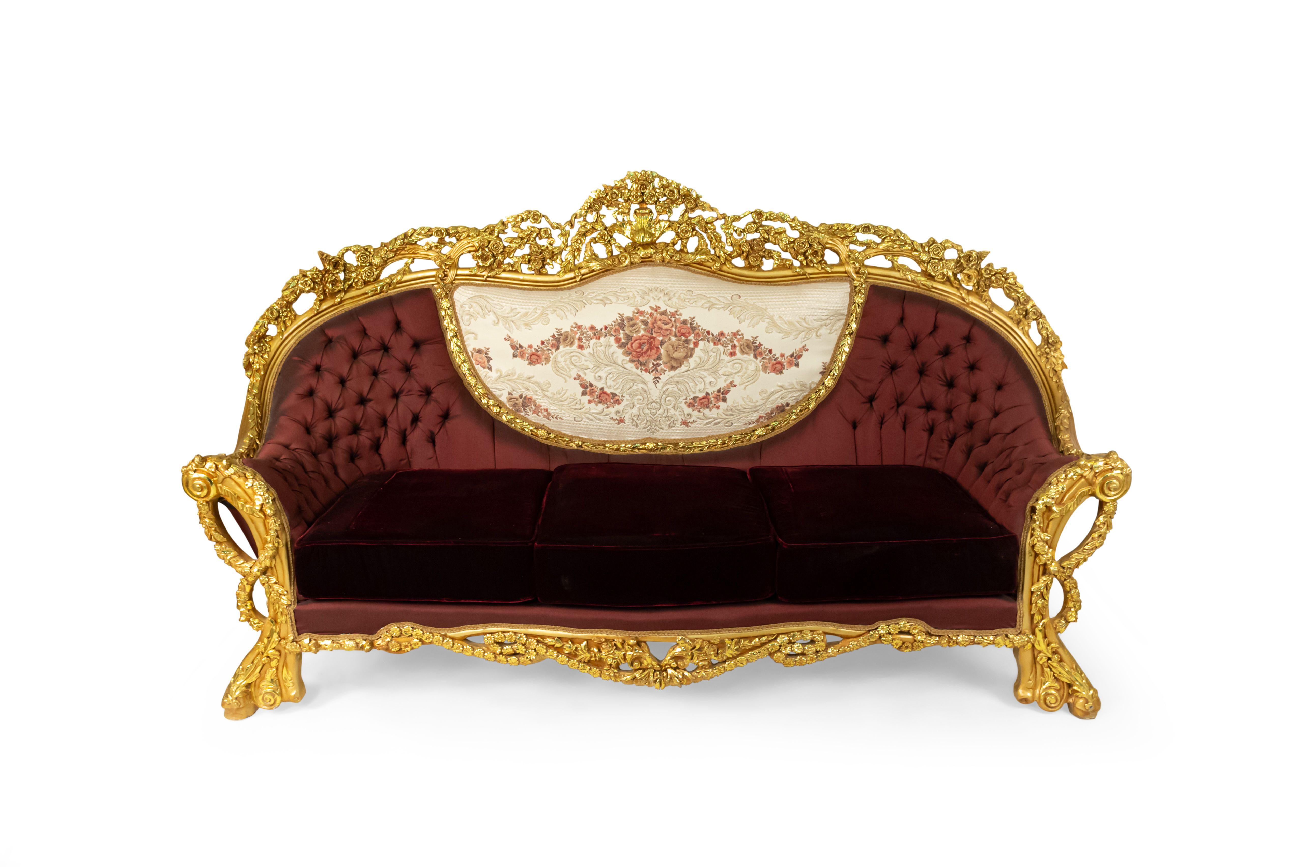 Italian Baroque style 20th century large settee with giltwood filigree frame & button-tufted burgundy & cream upholstery with embroidered flowers and burgundy velvet seat cushions.