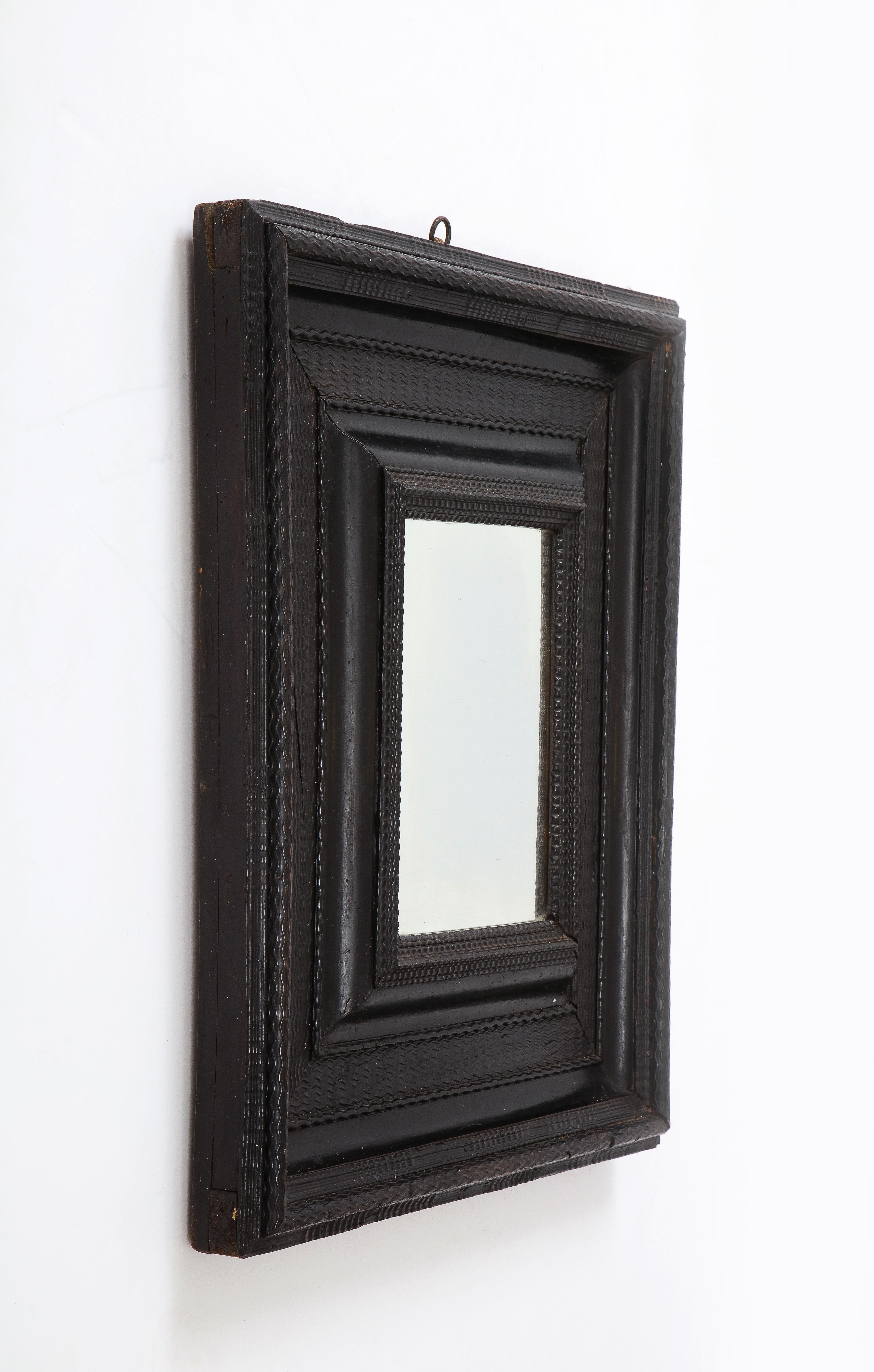 Mercury Glass Italian Baroque Carved Ebonized Frame/Mirror For Sale