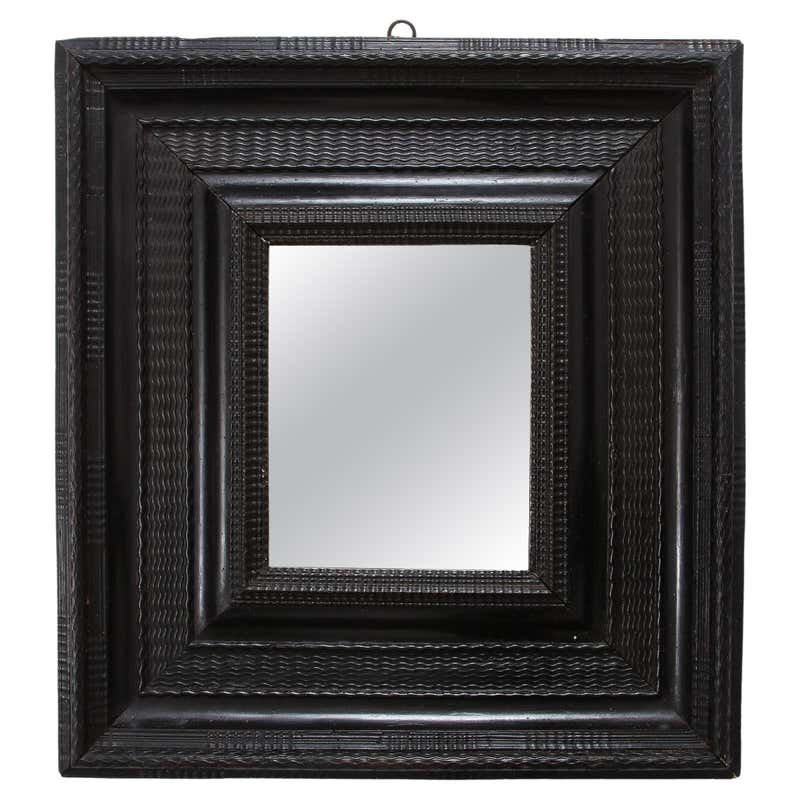 Carved ebonised wood mirror and trompe l'oeil turshell, XIXth c. For ...