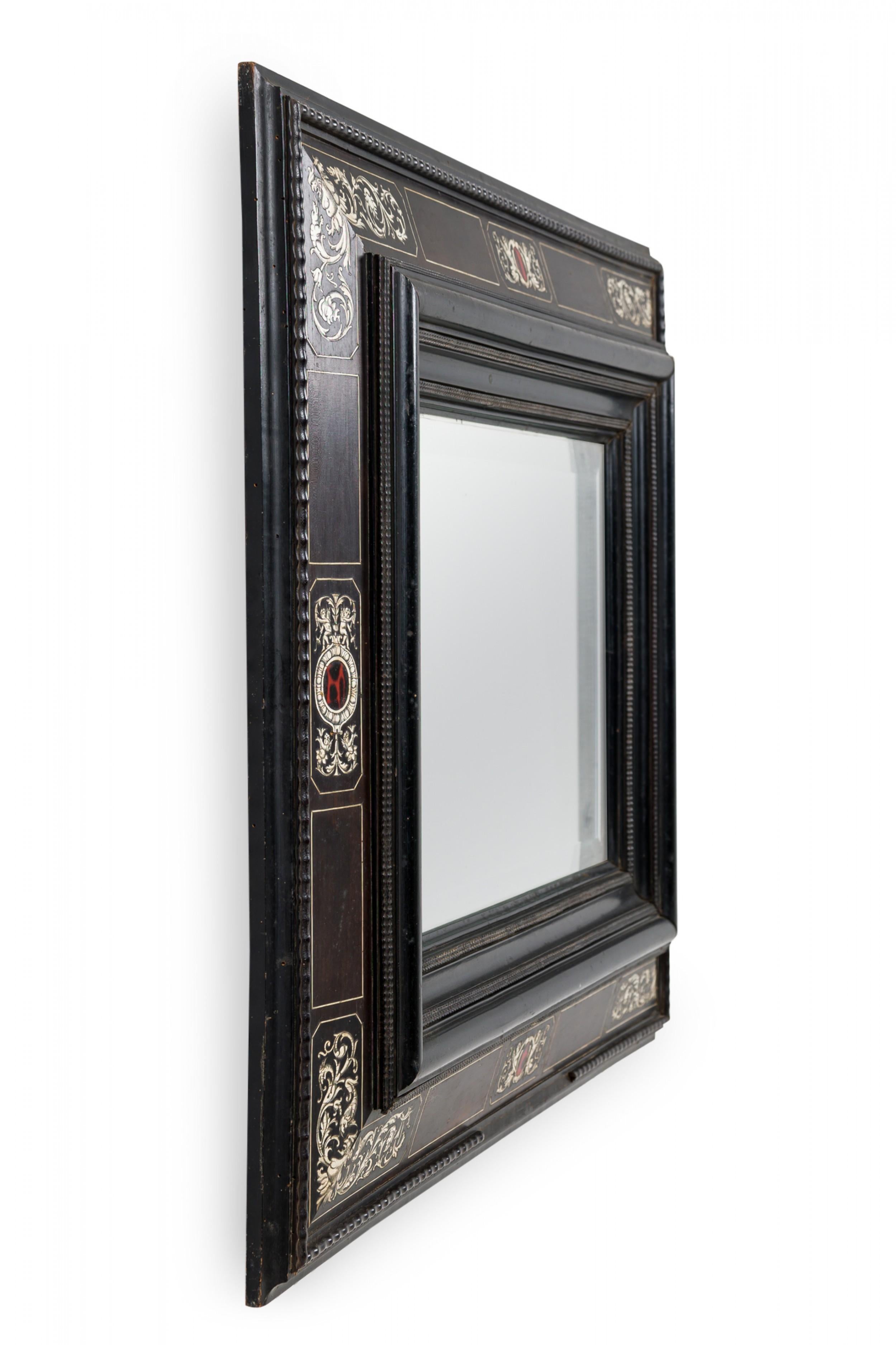 Italian Baroque (18th century) rectangular wall mirror with an ebonized wood frame featuring inlaid decorative specimen marble and bone with beveled edges.