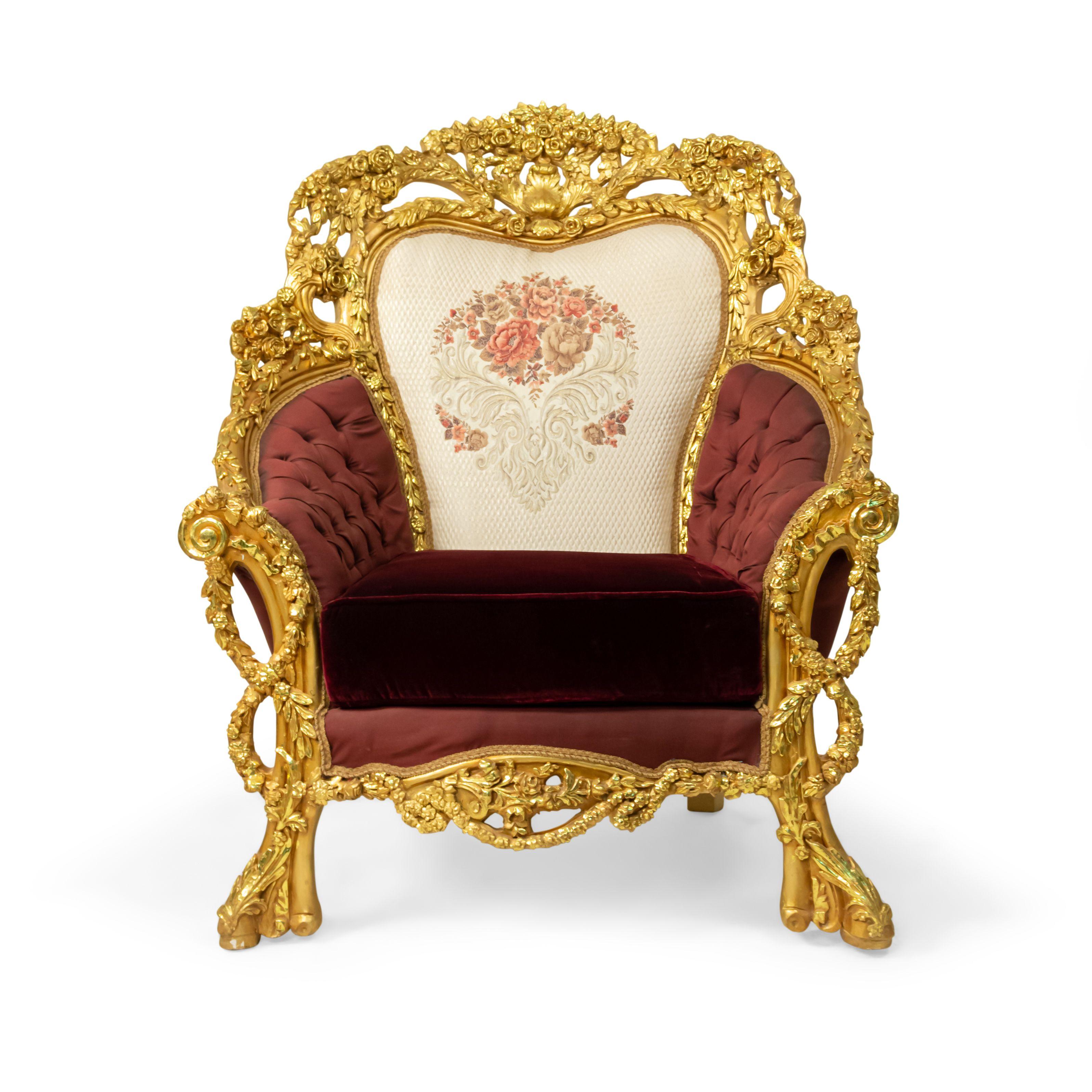 Pair of Italian baroque style 20th century armchairs with giltwood filigree frames, button-tufted burgundy and cream upholstery with embroidered flowers, and burgundy velvet seat cushions.