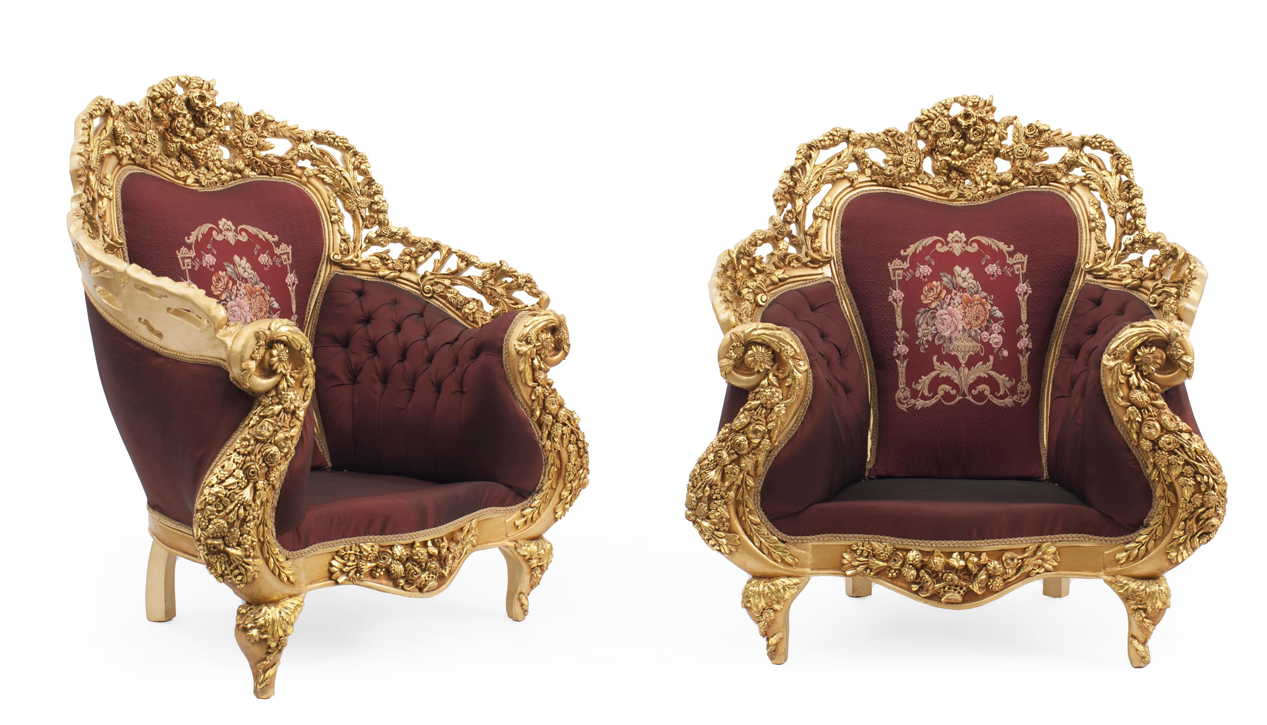 Pair of Italian Baroque style 20th century armchairs with gilt wood filigree frames & burgundy button-tufted upholstery with embroidered flowers and burgundy velvet seat cushions.