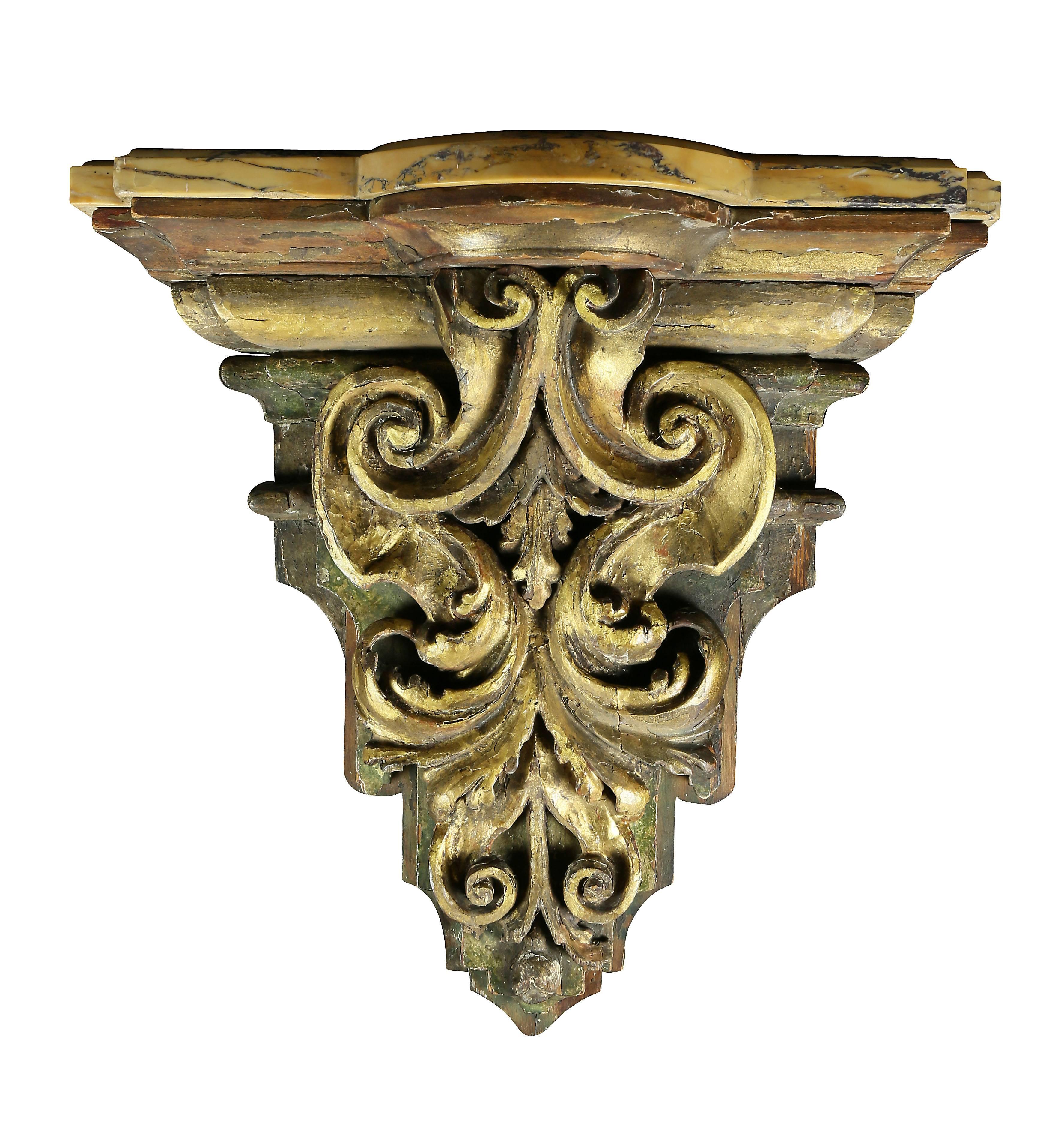 With rectangular Siena marble top and acanthus carved gilded wood bracket. 
 