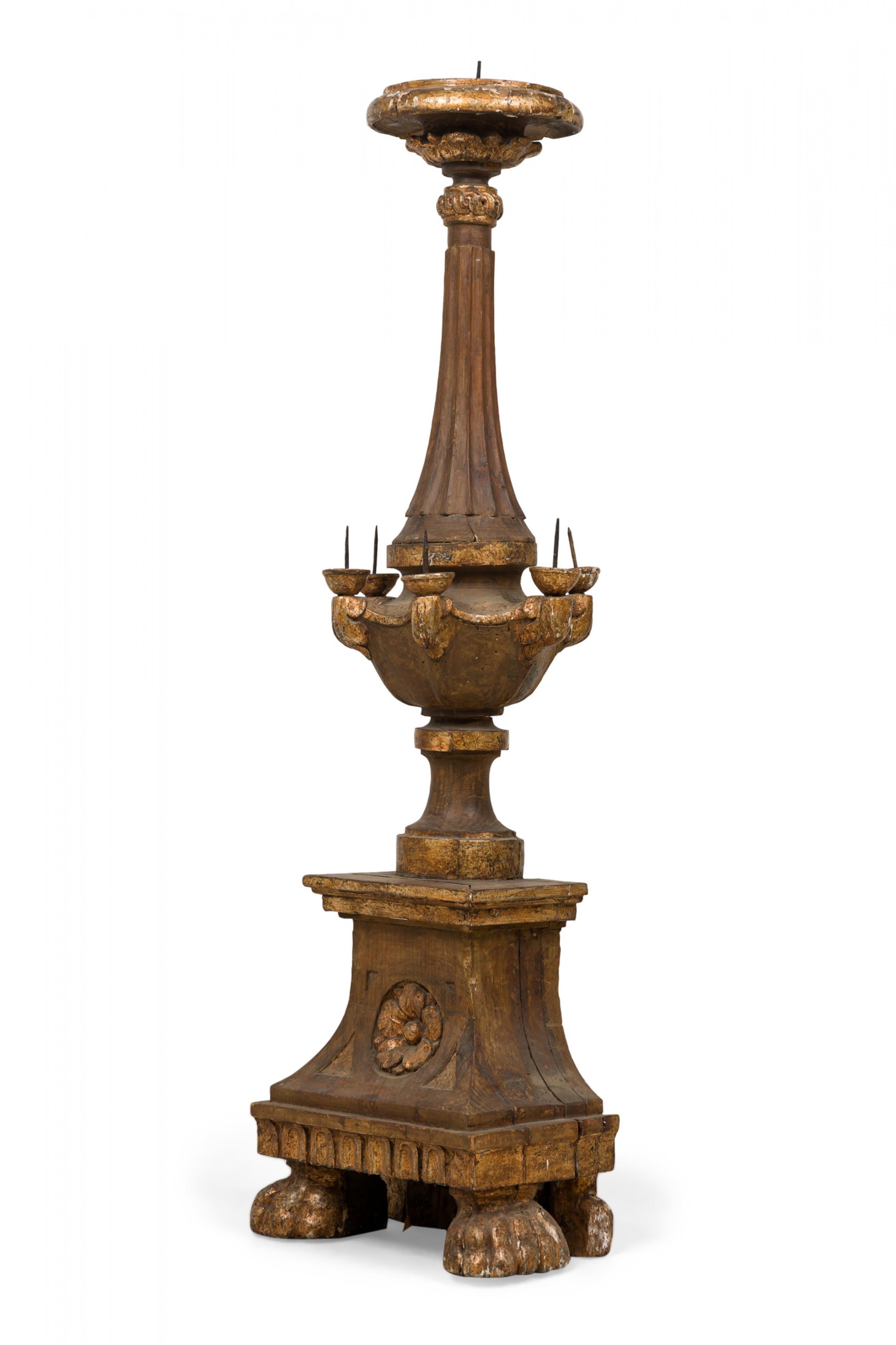 Italian Baroque (18th Century) monumental altar candlestick in a columnar form with carved detail and a gilt finish and having 5 lower candle holders (flat on back).
