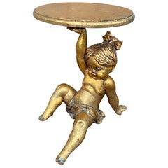 Putto barocco italiano neoclassico in legno dorato che sostiene una mensola