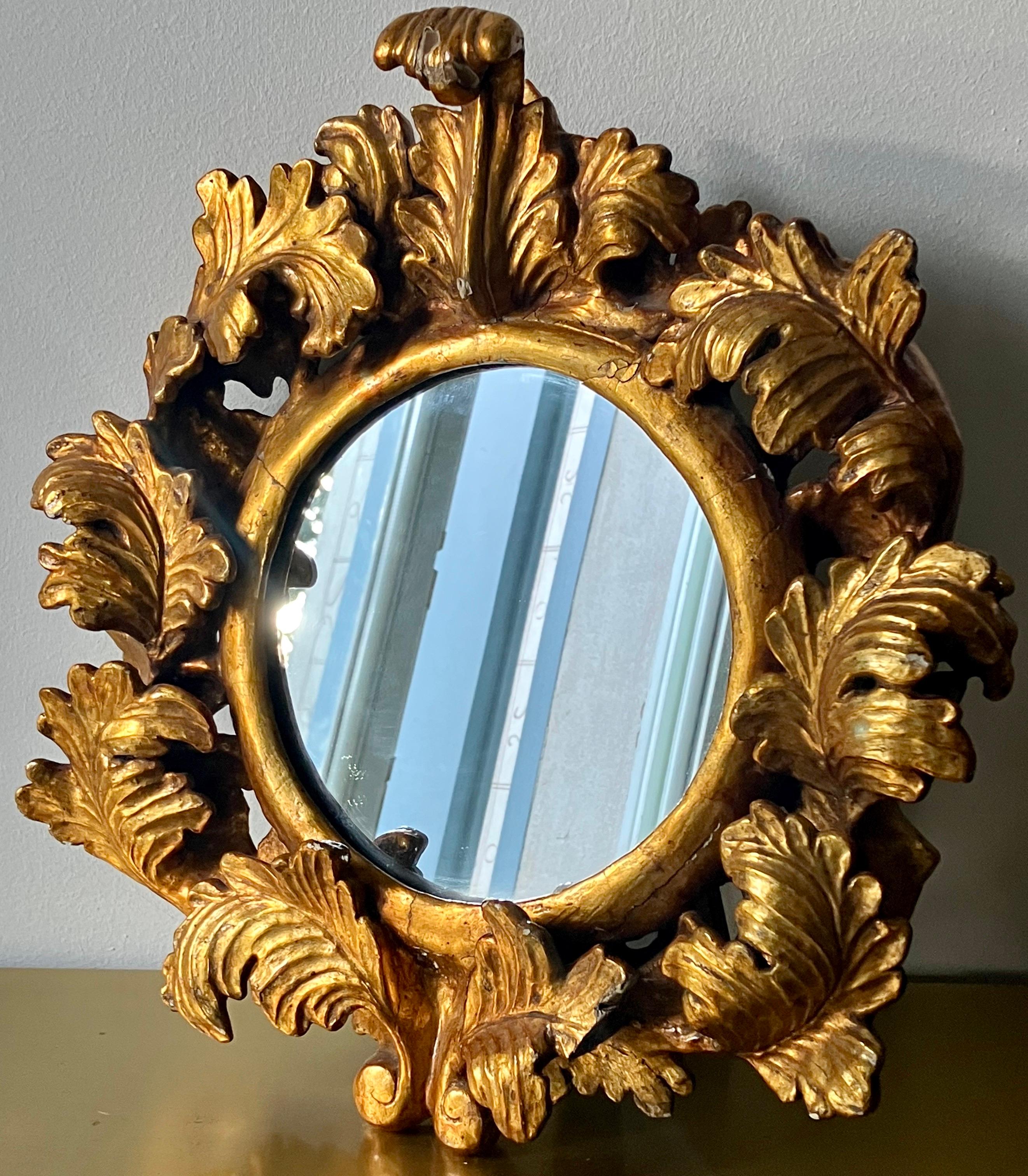 Original round mirror from 18th century with carved giltwood original feame. 
 Provenance: Sicily : 
ancient noble residence in Palermo. 

Some defects and lacks due to age. 
The rear support for adaptation to tabletop use, is not original.
(