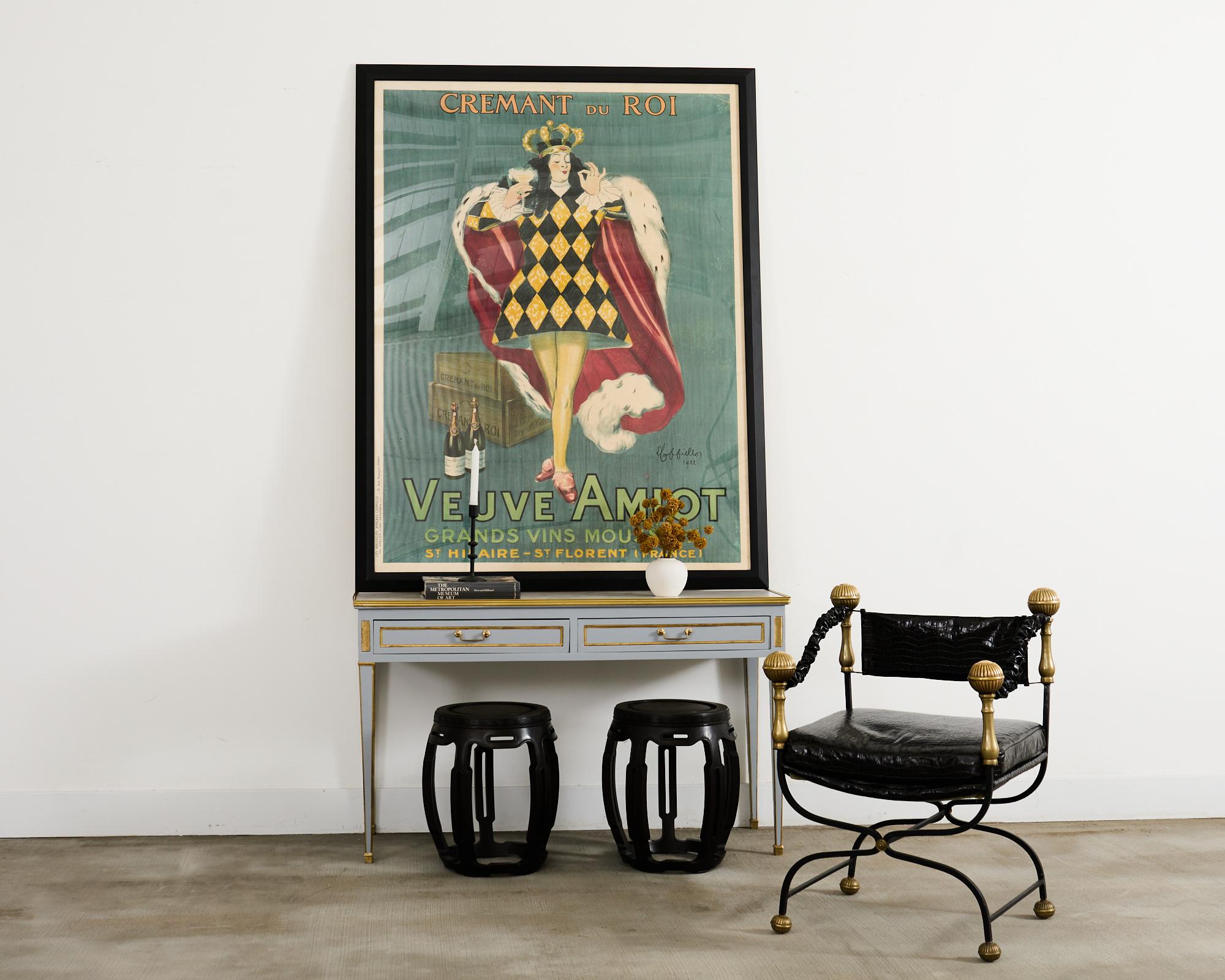 Opulent Italian wrought iron Savonarola armchair made in the Baroque or campaign style. The chair features an iron frame with curule style legs and imposing patinated bronze mace finials. The seat is upholstered with dramatic faux