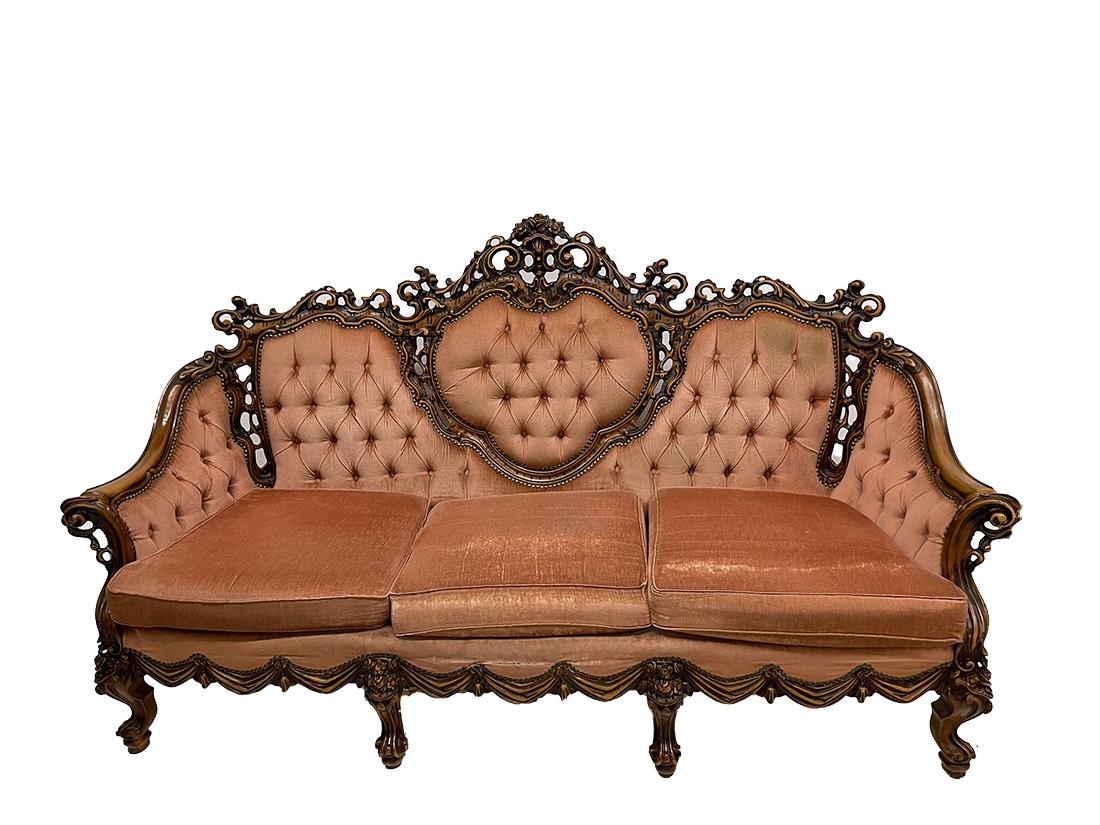 Italian Baroque sofa and armchairs, 1970s

A richly carved wood sofa set consisting of a sofa and two armchairs in Baroque style. Italian, 1970s
The pine sofa, colored in walnut, richly decorated with scrolls, garlands and flowers. The set has a