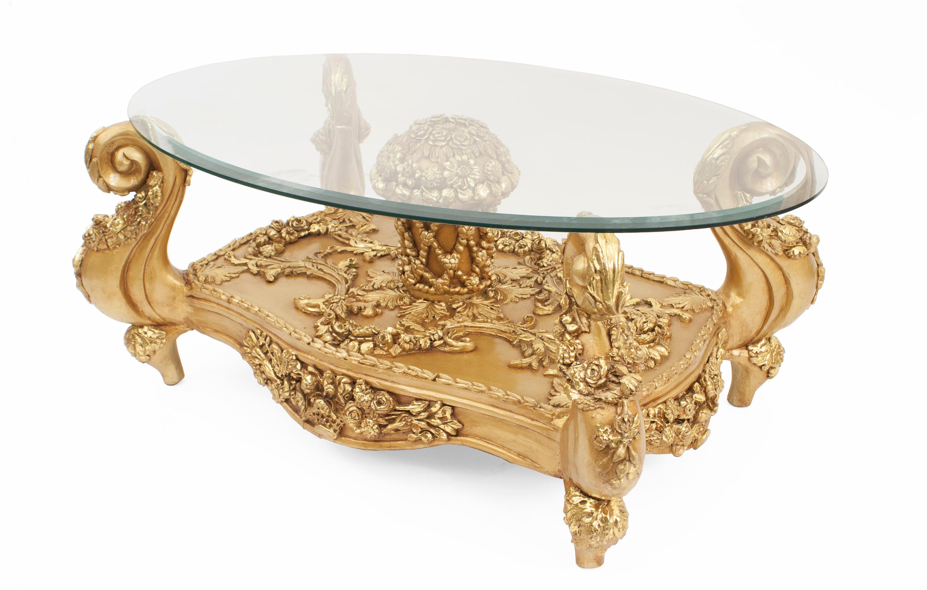 Italian Baroque style 20th century coffee table with giltwood filigree base and removable oval glass top.
 