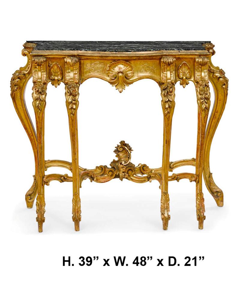 Unusual 19th century Italian Baroque style carved giltwood six legged console. The green marble top over a frieze with scrolling Acanthus leaf motif centered with a beautiful giltwood sea shell and supported by six legs connected by reversed scroll