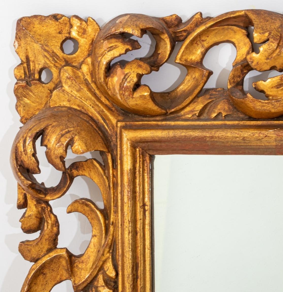 Italian Baroque style giltwood framed mirror, the scrolling foliate frame centering a mirror plate, B. Altman label on back. 

Dimensions: 32
