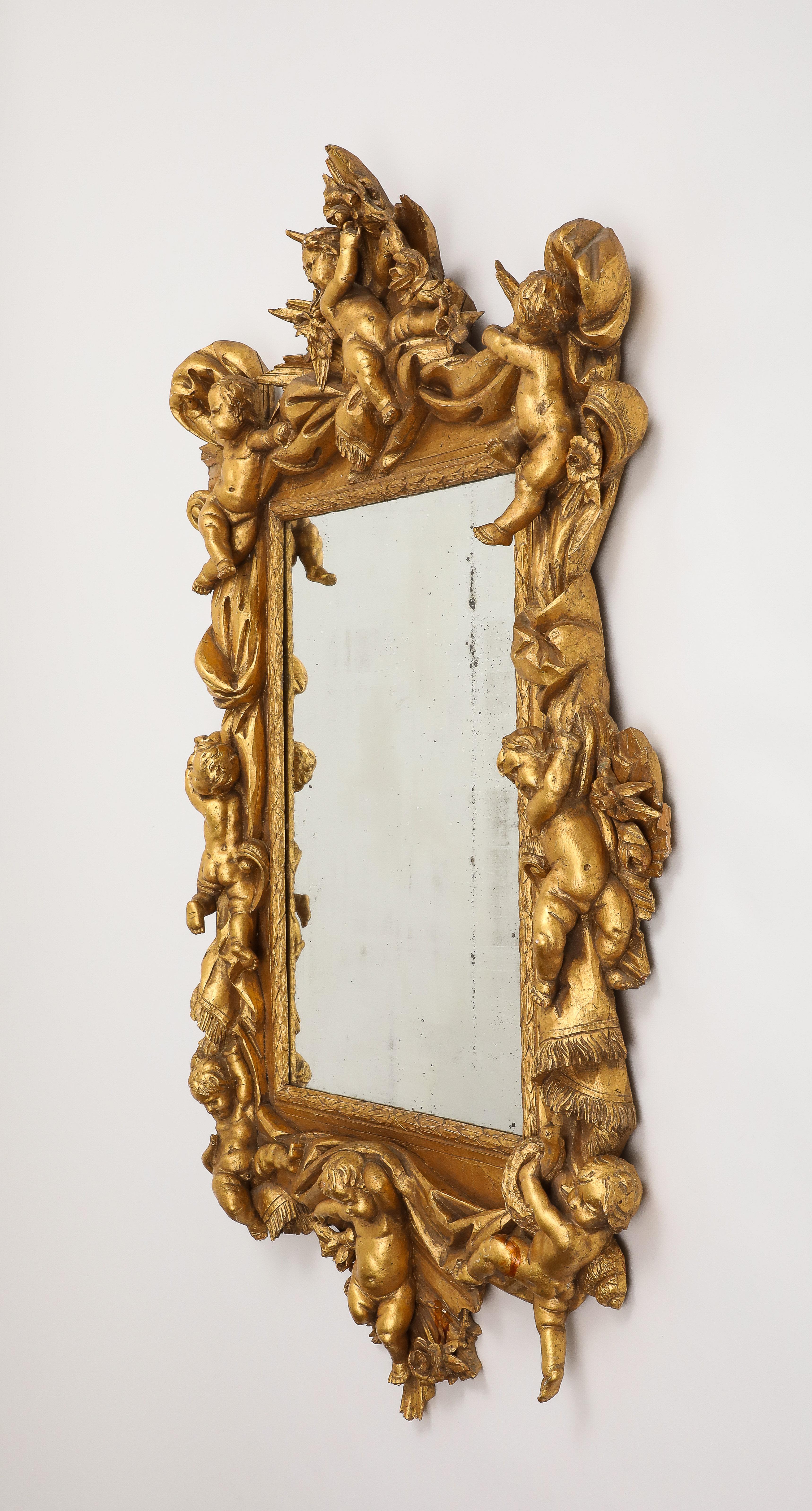 Baroque Miroir mural en bois doré de style baroque italien en vente