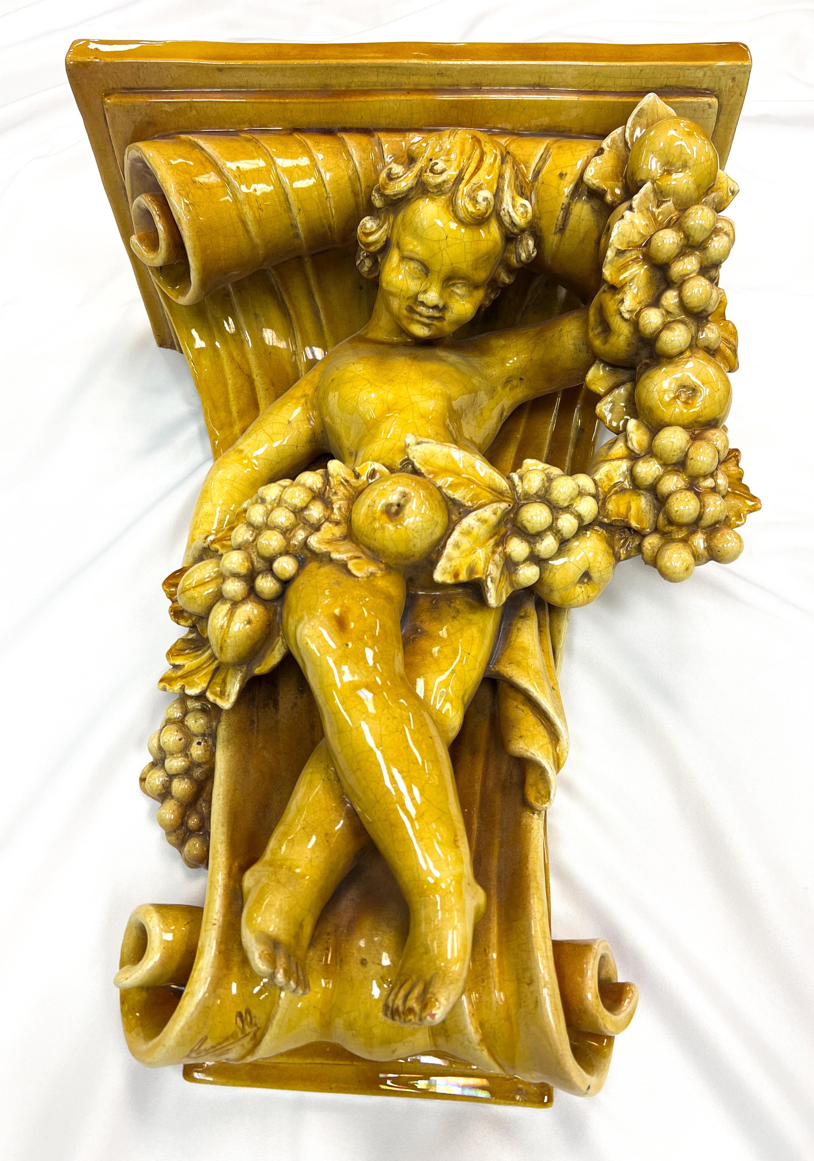 Fired Italian Baroque-Style Glazed Pottery Putto Wall Bracket For Sale